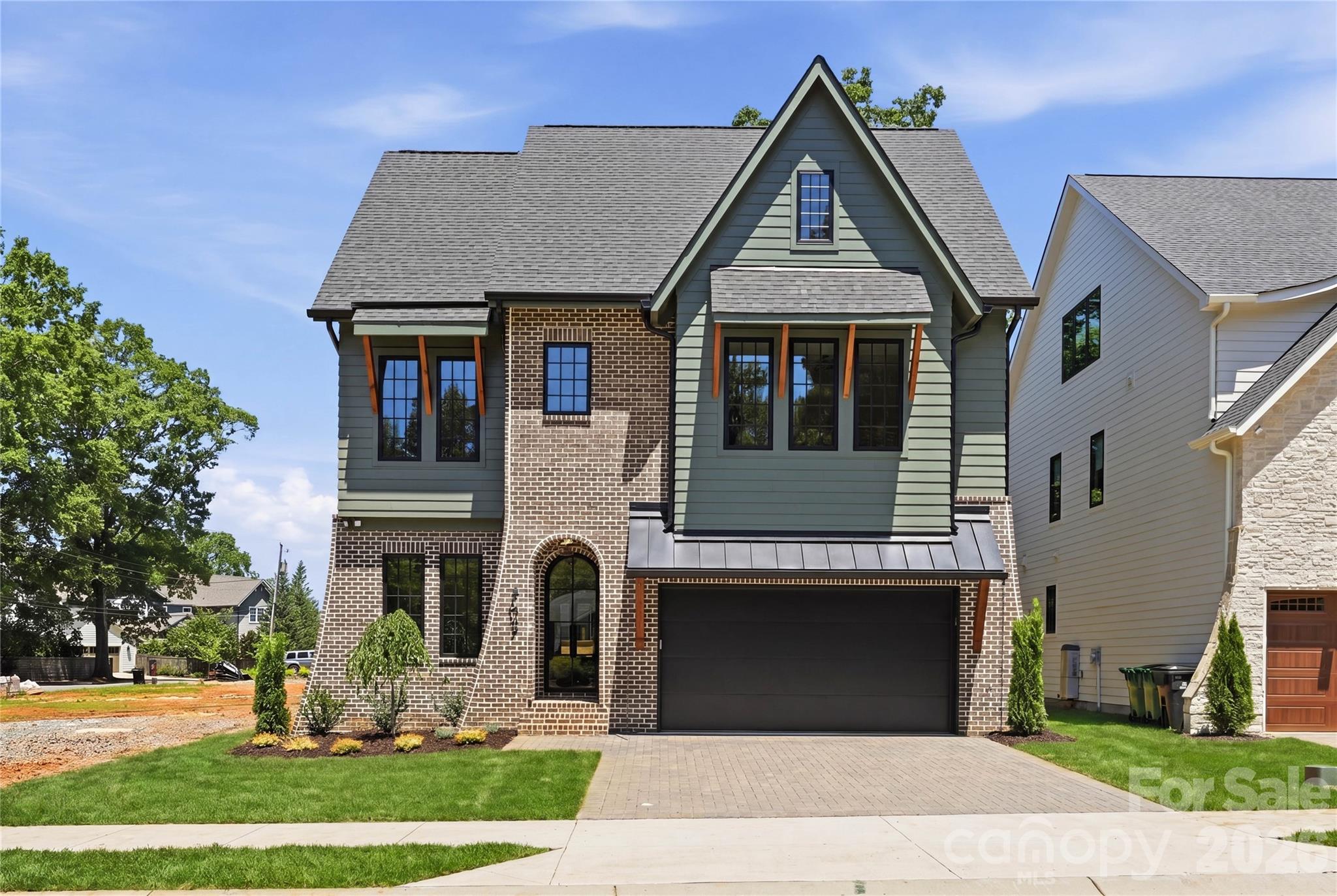Cotswold’s newest home by Image Custom Homes offers 4,272 sq ft, 5 bedrooms, 5 bathrooms, and a functional open floor plan with high end finishes throughout. The kitchen features custom cabinetry, a walk-through scullery with a second dishwasher, full-height wine refrigerator, solid quartz backsplash, 66” refrigerator, and 48” gas range.
The living room is anchored by a bifold door that opens to a screened porch with a fireplace, creating seamless indoor-outdoor living. The dining area is wrapped in windows, filling the space with natural light. A spacious flex room with a bar area and cozy reading nook adds versatility for entertaining, working, or relaxing.
What truly sets this property apart is the private tree-save area with mature trees behind the home, exclusively accessible to the seven lots in this special Cotswold pocket community and directly accessible from the backyard.