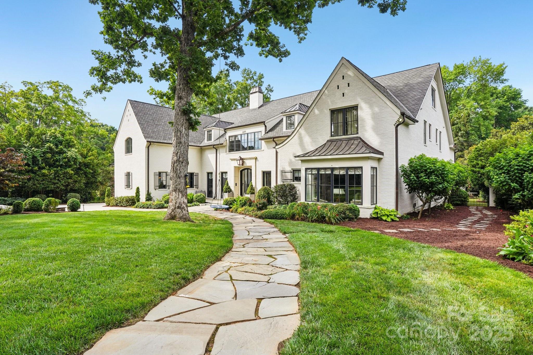 A true Foxcroft estate with timeless luxury and grand-scale living. This newly updated 8,974 sq ft home offers 6 spacious bedrooms, 5 full and 2 half bathrooms, and has been thoughtfully renovated throughout—enhancing bedrooms, bathrooms, and main living areas with fresh, designer finishes. Set on a beautifully landscaped .60 acre lot, the home features a painted brick exterior, XL 3-car garage, and handcrafted details including custom millwork, TruStile doors, and refined lighting. The main-level primary suite is a private retreat with a sitting vestibule, coffee bar, spa-style bath, and room-sized closet. Flexible living spaces include a formal study, guest suite, media room, fitness/sauna space, bonus room, and craft/laundry room. Outside, enjoy a covered terrace, outdoor kitchen, limestone pool deck, and lush backyard with maintenance-free turf—perfect for pets and play. Ideally located minutes from SouthPark Mall, fine dining, top schools, and more.