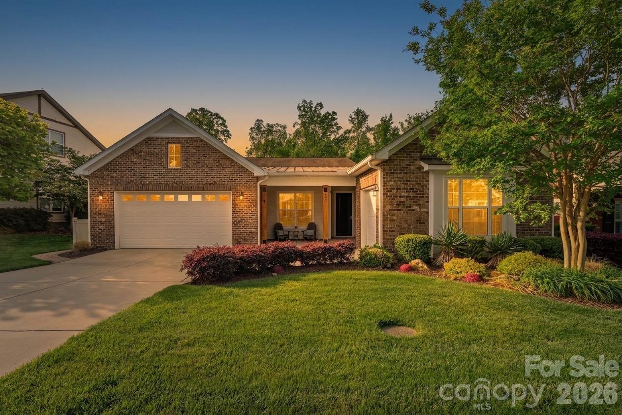 Enjoy resort-style living in the award-winning 55+ community of Trilogy Lake Norman, where every day feels like a getaway. Ideally located just minutes from Lake Norman and close to shopping, dining, medical facilities, and everyday conveniences, this beautifully appointed 3-bedroom, 3-bath home offers the perfect combination of luxury, comfort, and convenience. With easy access to Charlotte and Charlotte Douglas International Airport, you’ll enjoy peaceful lake-area living while staying connected to everything the Charlotte region has to offer.

Inside, the thoughtfully designed open floor plan is ideal for both everyday living and entertaining. The gourmet chef’s kitchen features upgraded cabinetry, creating a bright and inviting space perfect for gathering with family and friends. The spacious primary suite includes an expanded sitting area with large windows overlooking the private backyard, along with a luxurious spa-inspired shower upgrade.

A versatile hideaway room offers endless possibilities and can easily serve as a yoga studio, craft room, home office, or media retreat. Two additional guest bedrooms, each with ensuite baths, are thoughtfully positioned at the front of the home to provide added privacy for visitors.

Additional highlights include a rare 3-car garage configuration with extra space ideal for a workshop or golf cart parking, stunning tile flooring throughout the main living areas with lush carpet in the bedrooms only, a large screened lanai, and an extended paver patio complete with a built-in Blackstone grill—perfect for outdoor entertaining. The low-maintenance backyard features premium turf, mature trees, and a desirable private homesite.

Homeowners enjoy access to world-class amenities, including a resort-style pool, tennis and pickleball courts, scenic walking trails, a stunning clubhouse, state-of-the-art fitness center, on-site dining, vibrant social clubs, and access to the Freedom Boat Club. This exceptional home offers the opportunity to enjoy an active, luxury lifestyle within one of the most sought-after resort-style communities in the Lake Norman area.