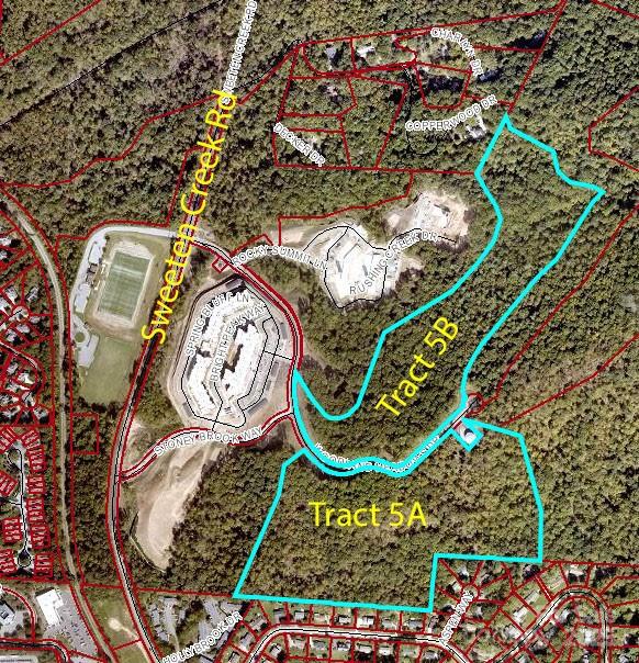Development Opportunity in South Asheville.  51.65/ac tract now available.  Paved road to the Property.  Curb & Gutters are in place with access to public water and sewer.  Woodland Meadows has access to traffic light on Sweeten Creek Road, next to and behind the New Ellison apartments.  This property was approved for 11 Single Family lots per Buncombe County Board of Adjustments.  PUD was approved. The properties are on both sides of Woodland Meadows Rd.  Could be sold in 2 tracts (Tract A 27.84/ac and Tract B 23.81/ac).  Great Mountain views.  Two Tax PINS:  9656-31-9340 & 9656-42-3541.  Property runs up the hill to cul-d-sac.  Property Zoned R-LD.