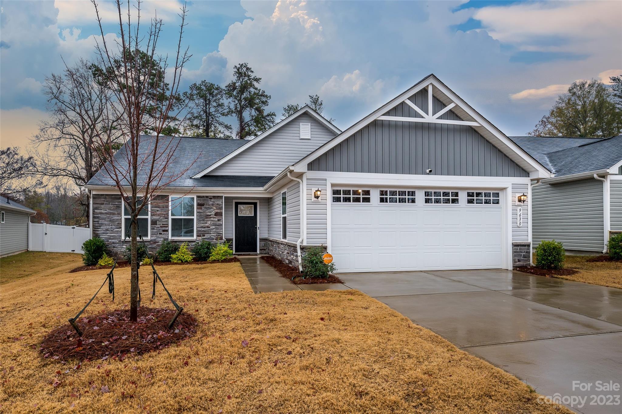 Seller has a 2.75% assumable VA loan and also this property qualifies for a grant program offering closing costs and down payment assistance.  Split bedroom floor plan with primary bedroom separate from the secondary bedrooms.  Stylish cabinets with rollouts, upgraded quartz countertops, wide plank flooring throughout the living areas, tiled baths, and laundry room work sink.  Open layout with lots of lighting, remote-controlled shades, wifi enabled thermostat, deep garage with work bench niche and freshly epoxied floor  All SS kitchen appliances.  Fridge, washer & dryer remain.  Enjoy outdoor living on the screened porch with a grilling patio with a treed view.  Nicely landscaped, full privacy fence, backs up to common area.  Low-maintenance living with lawn care included in the HOA dues.  Great location on a low traffic, dead end street.  Just 2 miles from I-485, which puts you minutes from Harrisburg or Mint Hill, and will get you anywhere you need to go within the Charlotte area.