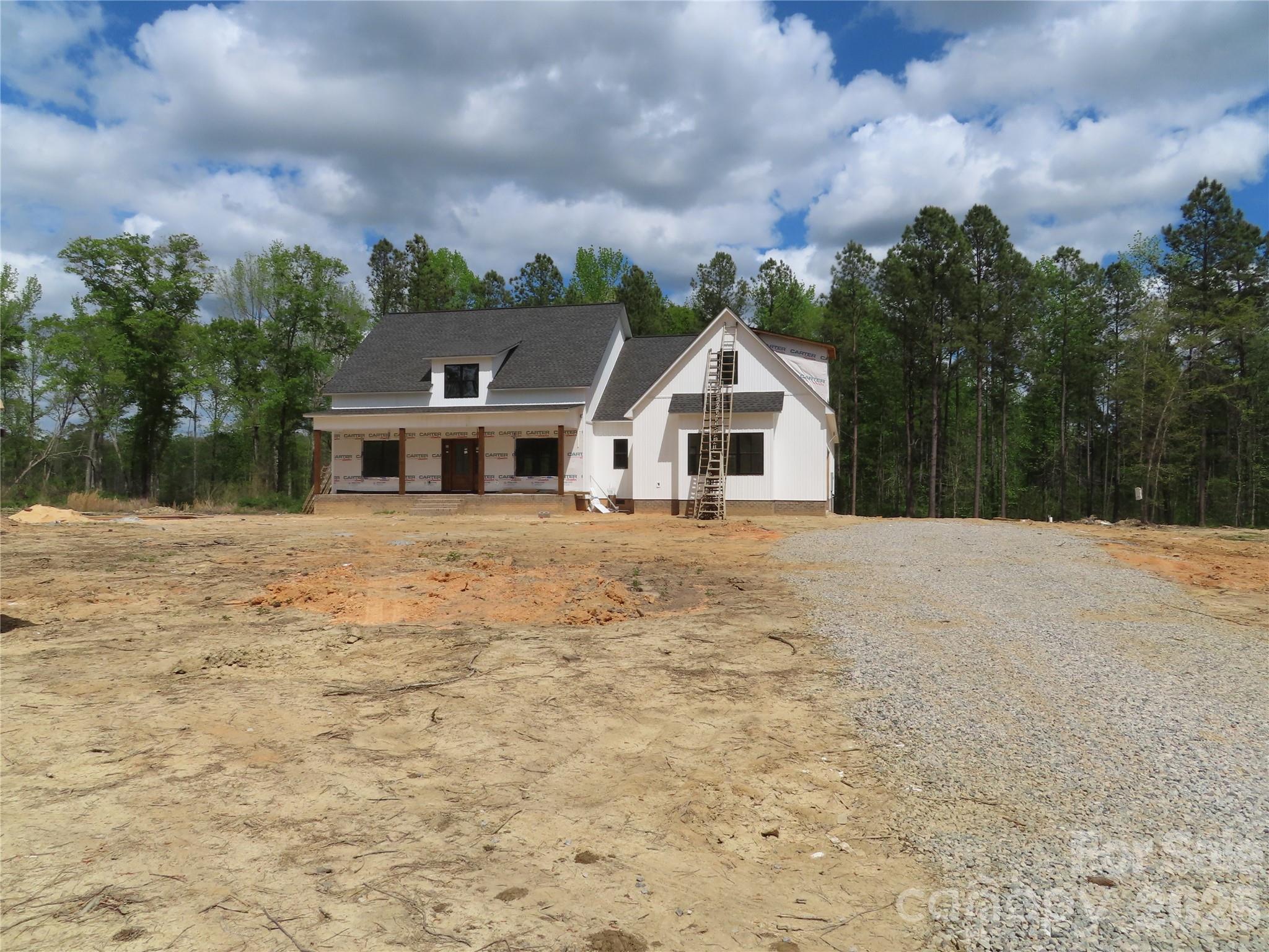 Looking for a house with land? This one has it!  Sitting on 12 acres of flat land and close to I-77. Easy commute to Charlotte. This new construction home has 3 bedrooms, 2.5 baths ( one is a Jack & Jill Bath),bonus room, Dining room,Kitchen, Breakfast area & large laundry room. The primary suite is extra large with his and her closets. The 2 car garage is oversized . In addition to the front porch, there is a nice sized covered back porch. 
This one should be finished by the end of June. Come and look!