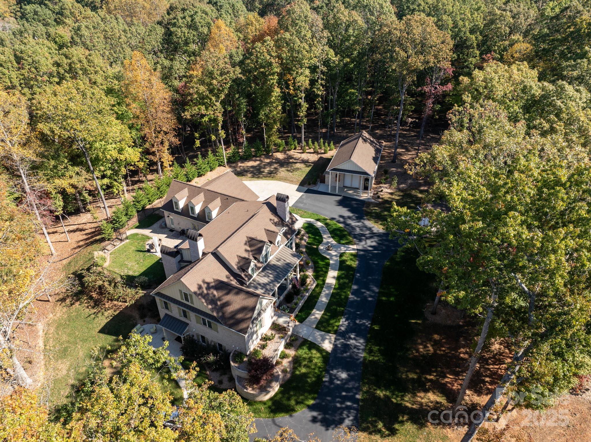 Custom home w/ attached 3car garage & detached 3 car garage (both climate controlled)situated on 5 acres.High end finishes, including 7" french white oak floors,slate tile on all porches w/ reclaimed wood ceilings, double mahogany front doors, roll out cabinetry drawers, designer lighting & control 4 automation.Open kitchen featuring a 10 foot island w/ walnut cabinets & solid granite top.An amazing appliance package including a gas Aga Elise range w/ double ovens, 5 gas burners & slide out broil oven.Great Room features a gas fireplace, coffered ceiling & opens to an amazing covered screened porch featuring a wood burning fireplace.Primary on main w/luxury bath w/ vessel tub, deluxe designer shower & custom closet.Upstairs features 3 secondary rooms, 3 full baths a large bonus room plus walk in storage.Basement w/ separate entrance features secondary living quarters featuring a kitchenette. Outside includes a 900+ sf detached garage with 24 foot ceilings perfect for a car lift or RV.