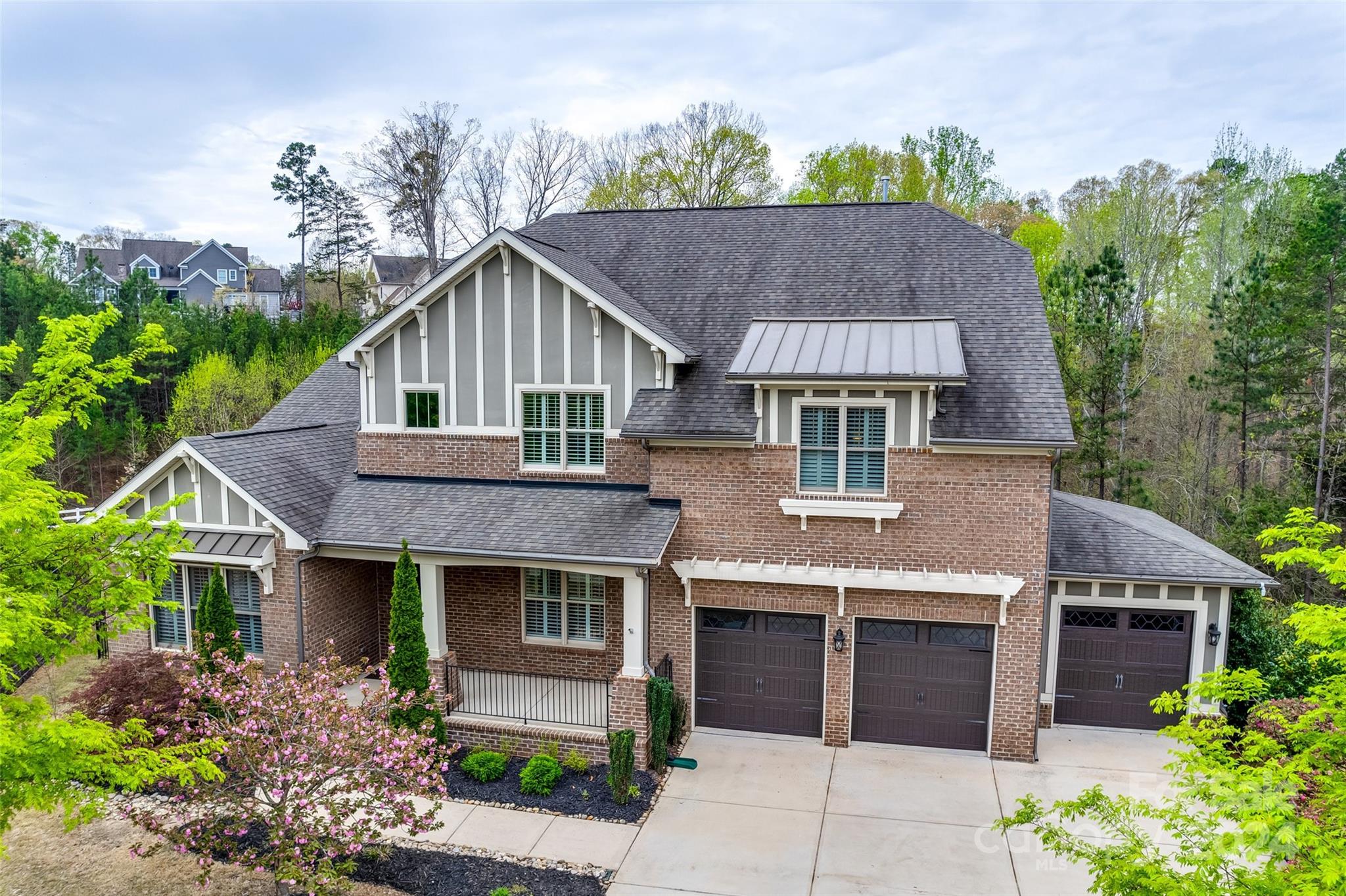 Welcome to luxury living in Baxter's River District! This stunning home offers unparalleled elegance & comfort, boasting 5 bedrooms & 4.5 bathrooms, & a fully finished, walk-out basement. Step inside to soaring ceilings, hardwood floors, & custom finishes throughout. The gourmet kitchen is a chef's dream, featuring top-of-the-line appliances, granite countertops, & a spacious island perfect for entertaining. Relax in the expansive main-floor primary suite with a spa-like bath & walk-in closet. The meticulously landscaped yard offers a private oasis complete with a screened porch, large deck, covered patio & fireplace, It backs to the Carolina Thread Trail leading down to the river. With access to the top-rated Fort Mill School District & a vibrant community, this is the epitome of upscale living. Enjoy the community pools, playgrounds, walking trails, tennis courts, shops/restaurants & all that Baxter Village has to offer!  Don't miss your chance to call this exquisite property "home!"