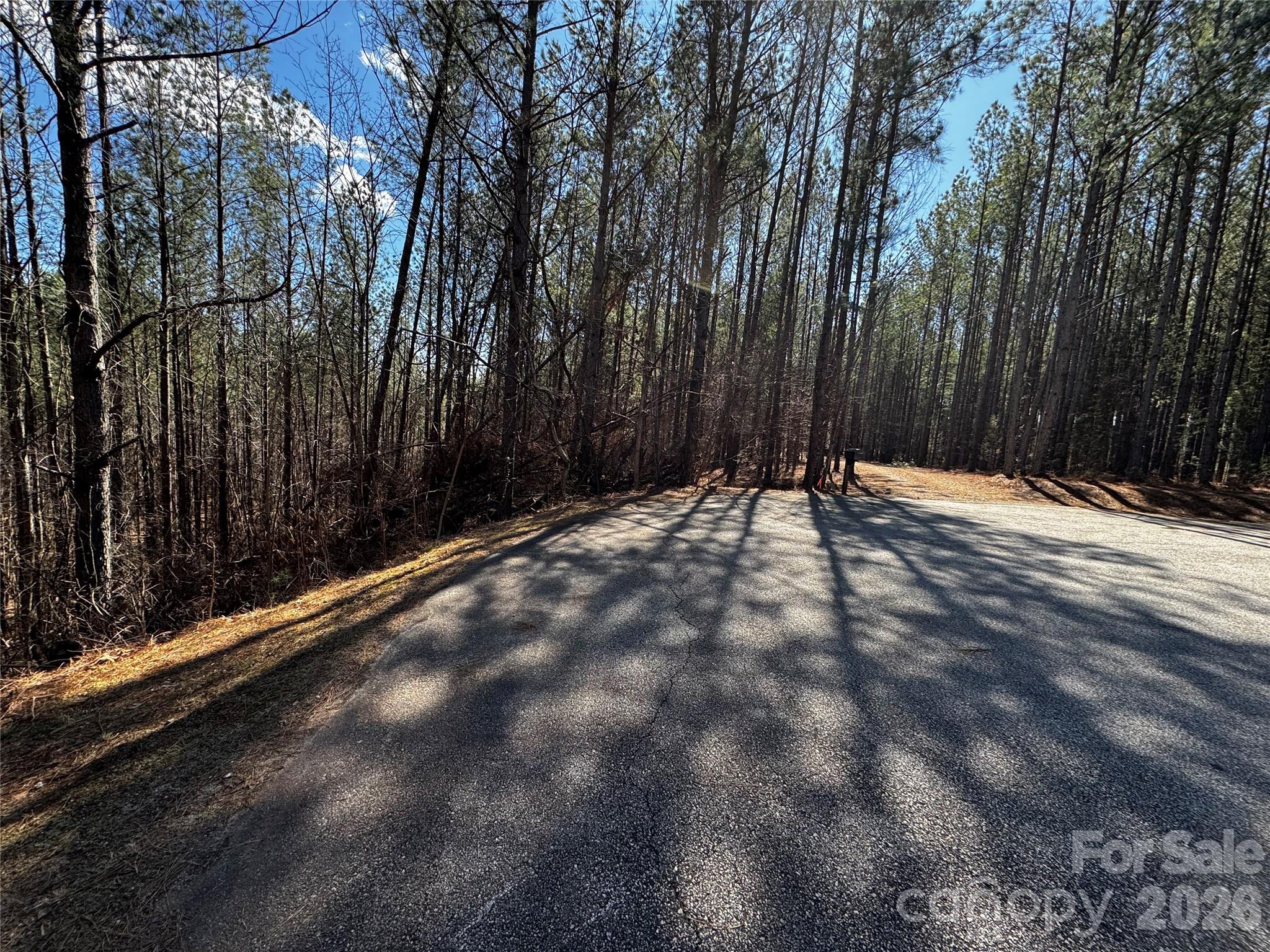 Private 4.780 acre lot on cul-de-sac. Community access to the Green River.   Contuck Preserve was designed to be a place residents can relax, recharge, and renew. The community is situated at the foothills of the Blue Ridge Mountains with convenient access to larger cities of Asheville, Hendersonville, and Charlotte.
