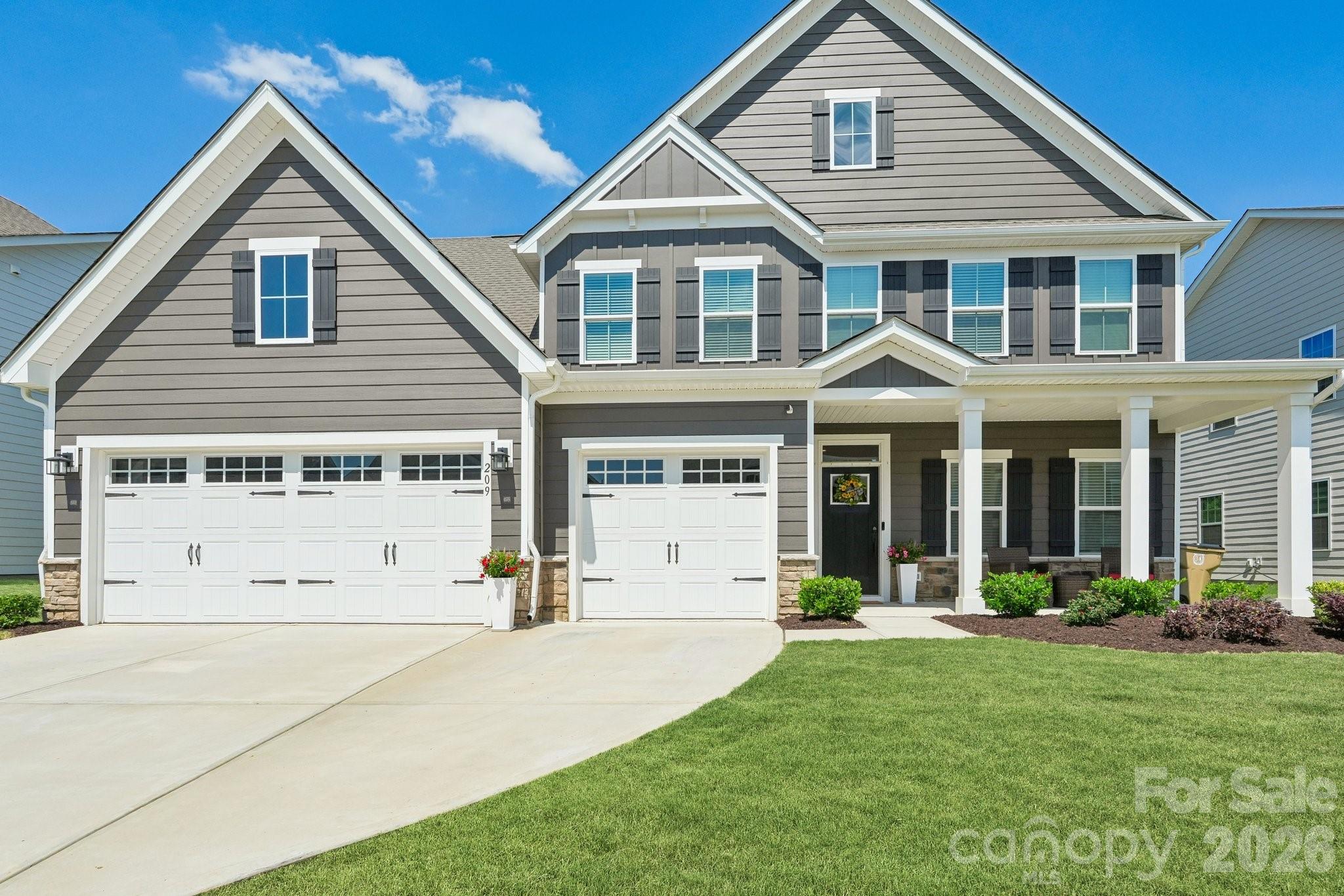 Luxury meets everyday comfort in this better-than-new 2024 custom-inspired residence, where every detail has been thoughtfully curated to create a truly unforgettable living experience. The expansive open-concept layout is filled with natural light and anchored by a chef-inspired kitchen featuring an oversized quartz island, premium stainless steel appliances, elegant cabinetry, a walk-in pantry with custom shelving, and seamless flow into the inviting living and dining spaces. A cozy fireplace creates the perfect atmosphere for relaxing evenings or entertaining guests in style.

A private guest suite with full bath on the main level offers ideal flexibility for visitors or multi-generational living. Upstairs, the luxurious primary retreat feels like a private spa with dual walk-in closets, refined finishes, and an elegant bath designed for relaxation. Spacious secondary bedrooms, beautifully appointed bathrooms, a versatile loft perfect for movie nights or entertaining, and a convenient upper-level laundry room complete the thoughtfully designed interior.

Step outside and discover an outdoor living space that rivals a luxury resort. The expanded travertine patio and covered porch with travertine flooring create a stunning backdrop for year-round entertaining. Enjoy evenings in the hot tub, relax under the covered porch fan, or host unforgettable gatherings around the custom granite and stone outdoor kitchen complete with a natural gas stainless steel Bull grill, refrigerator, and built-in trash receptacle. Three custom retractable screens allow for effortless indoor-outdoor living, while the fenced backyard offers both privacy and space to enjoy. Located in one of Union County’s most sought-after communities with convenient access to top-rated schools, shopping, dining, and major highways, this turnkey masterpiece is the perfect blend of luxury, comfort, and thoughtful design.