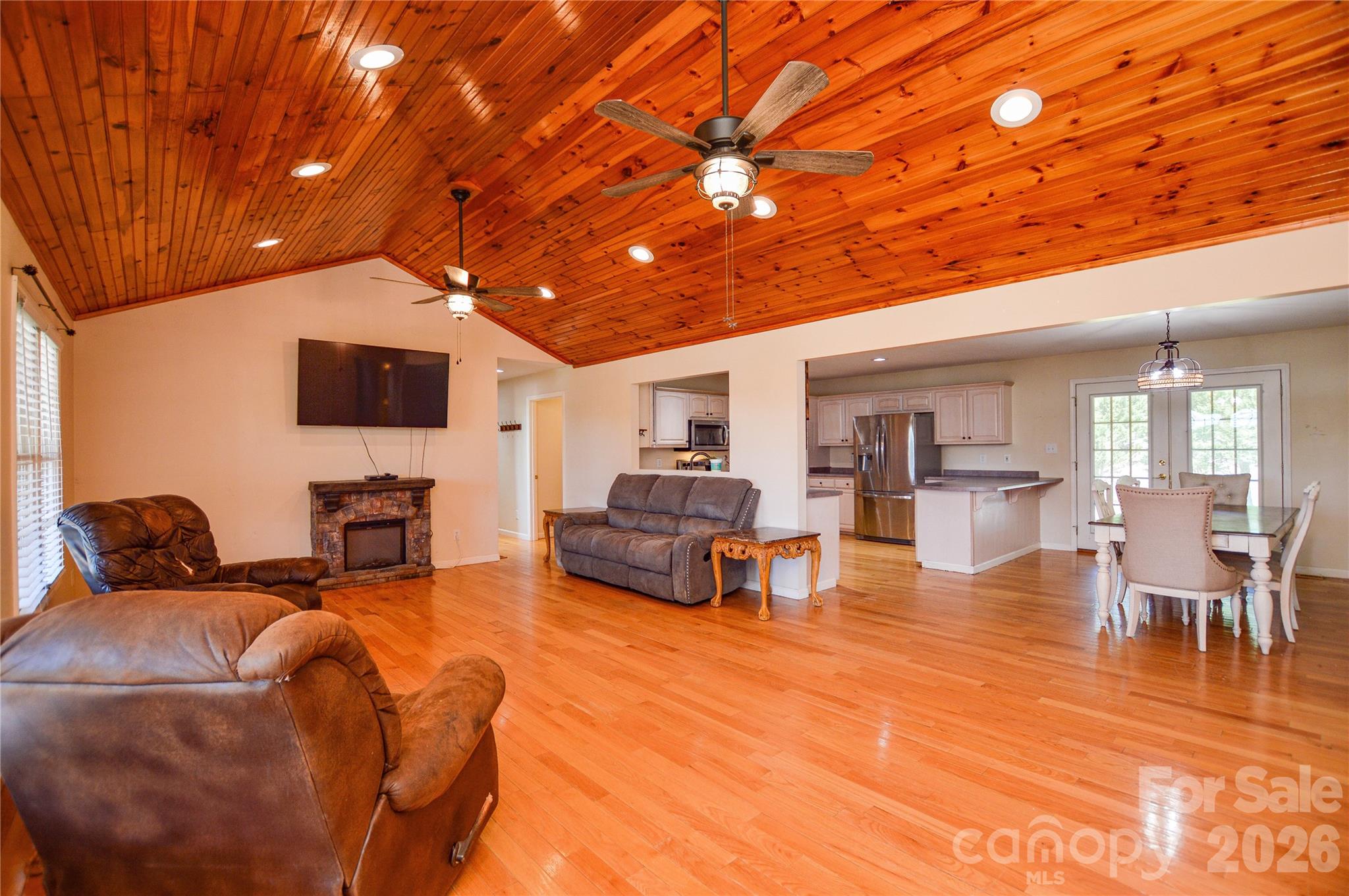 Wake up every day to breathtaking views of Lake Hickory from the comfort of your front porch! Nestled on approximately 2 private acres in the peaceful countryside of Taylorsville, this beautifully maintained 3-bedroom, 2.5-bath home offers the perfect blend of comfort, space, and scenery.

From the oversized driveway and impressive 4-car garage to the multiple exterior access doors and expansive front and back porches, this property was designed for easy living and entertaining. The lot features two fenced sections—one surrounding the main homesite and another extending behind the tree line—offering flexibility for pets, gardening, recreation, or additional outdoor enjoyment.

Enjoy the convenience of city water while also having a well already in place that can easily be switched over if desired. An irrigation system is installed (seller has no information). Located just minutes from The Sandbar Restaurant and access to Lake Hickory, this home delivers quiet country living with incredible views and convenience nearby.

As an added bonus, the seller is offering a $5,000 paint concession with an acceptable offer, giving buyers the opportunity to personalize the home and make it their own.