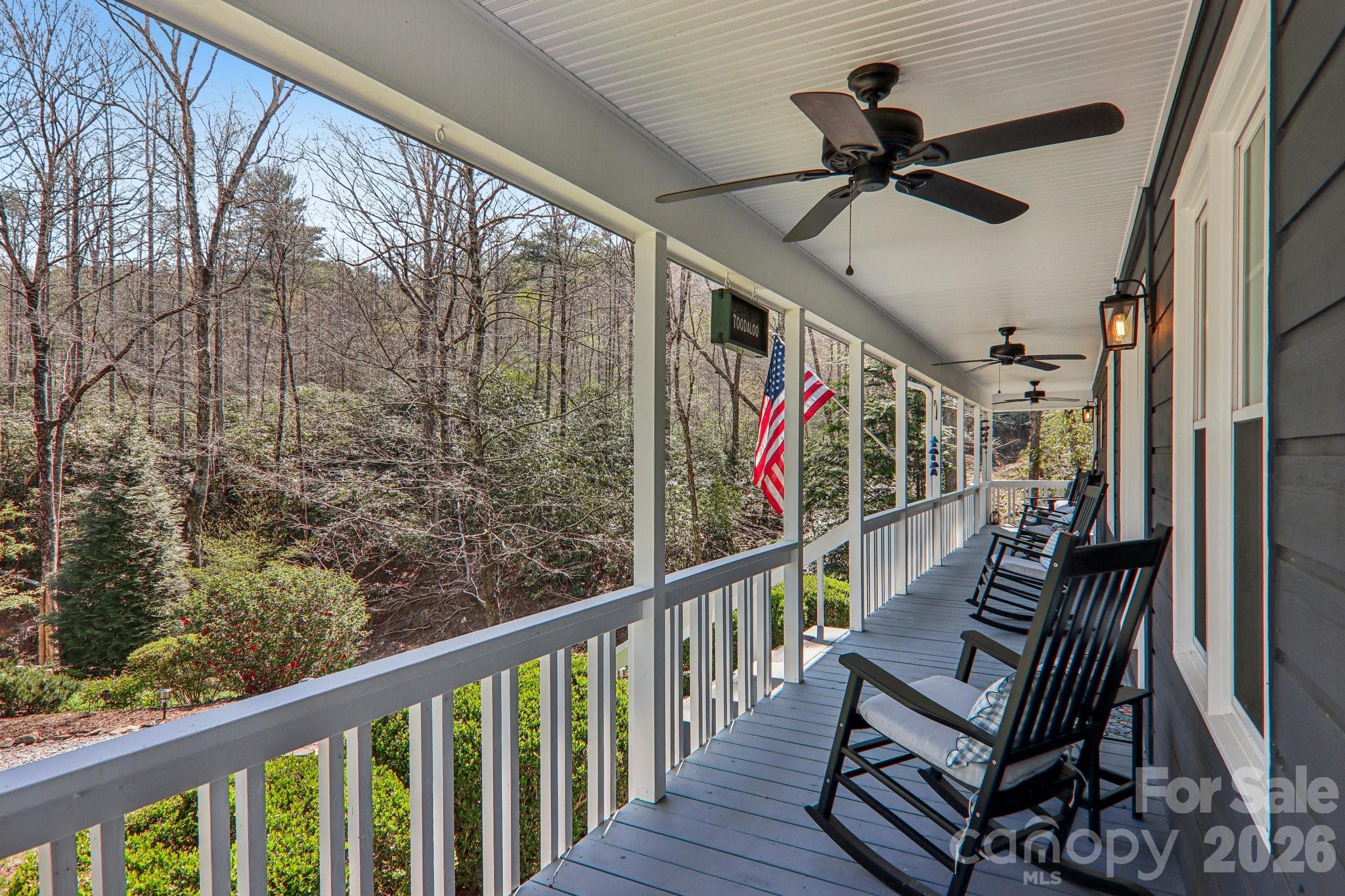 Turnkey Saluda retreat under $500K — 4.46 acres, audible creek, single-level, showroom condition! Need more, then read on… Tucked into 4.46 private acres along Camp Creek Road in Saluda, this two-bedroom, two-bath mountain cottage is the kind of place buyers wait for — and rarely find.
The sound of the creek carries across the property from the moment you arrive, creating the kind of peaceful backdrop that instantly slows everything down.
The covered front porch stretches the full length of the home, complete with ceiling fans and room for rocking chairs, morning coffee, and long conversations after sunset. A separate screened porch offers an even closer connection to the outdoors without sacrificing comfort.
Unlike larger homes that require more upkeep, this property delivers the part buyers come to Saluda for: a beautifully updated, easy-to-maintain cottage wrapped in privacy, acreage, porch living, and the sound of Camp Creek.
Inside, vaulted ceilings and warm hardwood floors anchor an open-concept living, dining, and kitchen space that feels both spacious and inviting. Stainless appliances, stone countertops, and tasteful finishes make the home immediately enjoyable as either a full-time residence or turnkey mountain retreat. Much of the carefully curated mountain cottage furnishings are negotiable with the sale.
Outside, mature landscaping delivers beautiful seasonal color, especially in spring when azaleas and mountain laurel begin to bloom. A large, detached storage shed provides additional flexibility for outdoor gear, tools, or hobby space.
And despite the privacy, you’re less than five minutes from downtown Saluda and approximately twenty minutes from vibrant downtown Hendersonville.
Properties that combine privacy, usable acreage, creek ambiance, turnkey condition, and close-to-town convenience in Saluda rarely stay available for long — especially during mountain getaway season.
Private. Peaceful. Fully ready to enjoy.
Schedule your showing before someone else claims the porch view and creek sounds for themselves.