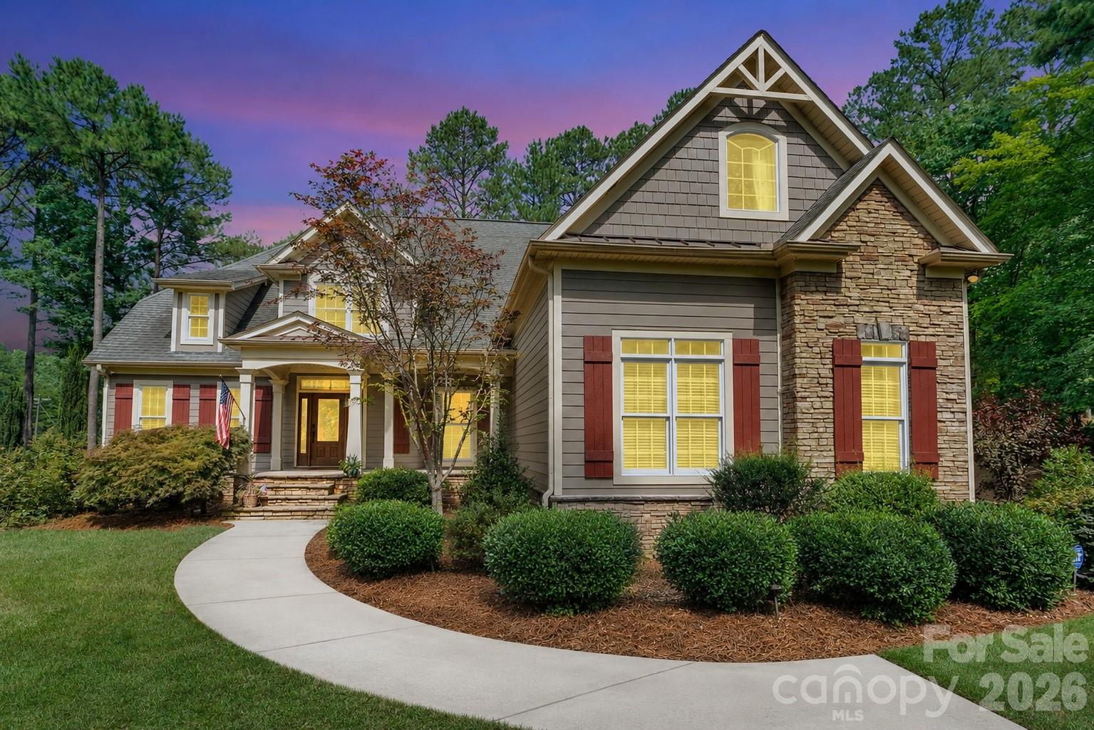 Welcome to an exceptional opportunity in the highly sought-after Pebble Bay community of Denver, North Carolina. Perfectly positioned on a private 1.25-acre cul-de-sac homesite, this remarkable estate offers over 5,400 square feet of thoughtfully designed living space, blending luxury, privacy, and outstanding investment potential.

From the moment you enter, soaring ceilings, extensive custom millwork, and walls of windows create an atmosphere of elegance and sophistication. The impressive two-story great room serves as the centerpiece of the home, filled with natural light and designed for both grand entertaining and comfortable everyday living. The spacious primary suite offers a true retreat, featuring a spa-inspired bath and generous walk-in closets.

The thoughtfully designed floor plan offers exceptional flexibility to accommodate a variety of lifestyles. In addition to the luxurious primary suite, the home's expansive layout provides multiple spaces that can easily function as additional bedrooms, guest suites, home offices, or hobby rooms, offering the potential for up to five bedrooms. Whether you're seeking multigenerational living, space for frequent guests, or room to grow, this residence adapts effortlessly to your needs without compromising comfort or elegance.

The fully finished lower level elevates the home's versatility with a second full kitchen, theater room, fitness area, recreation room, and multiple flex spaces—ideal for multigenerational living, extended guests, or entertaining on any scale.

Step outside to your private resort-style oasis where a custom saltwater pool, mature landscaping, expansive outdoor living areas, and a premium StruXure pergola create the perfect setting for relaxation and year-round enjoyment.

For investors, this property presents a rare opportunity. Currently leased through November at $6,500 per month, with the tenant expressing potential interest in extending the lease, the home offers immediate income-producing potential while maintaining long-term appeal for future owner-occupants.

Ideally located just minutes from Lake Norman, shopping, dining, and major commuter routes, this Pebble Bay estate delivers the perfect combination of luxury living, privacy, and investment value.