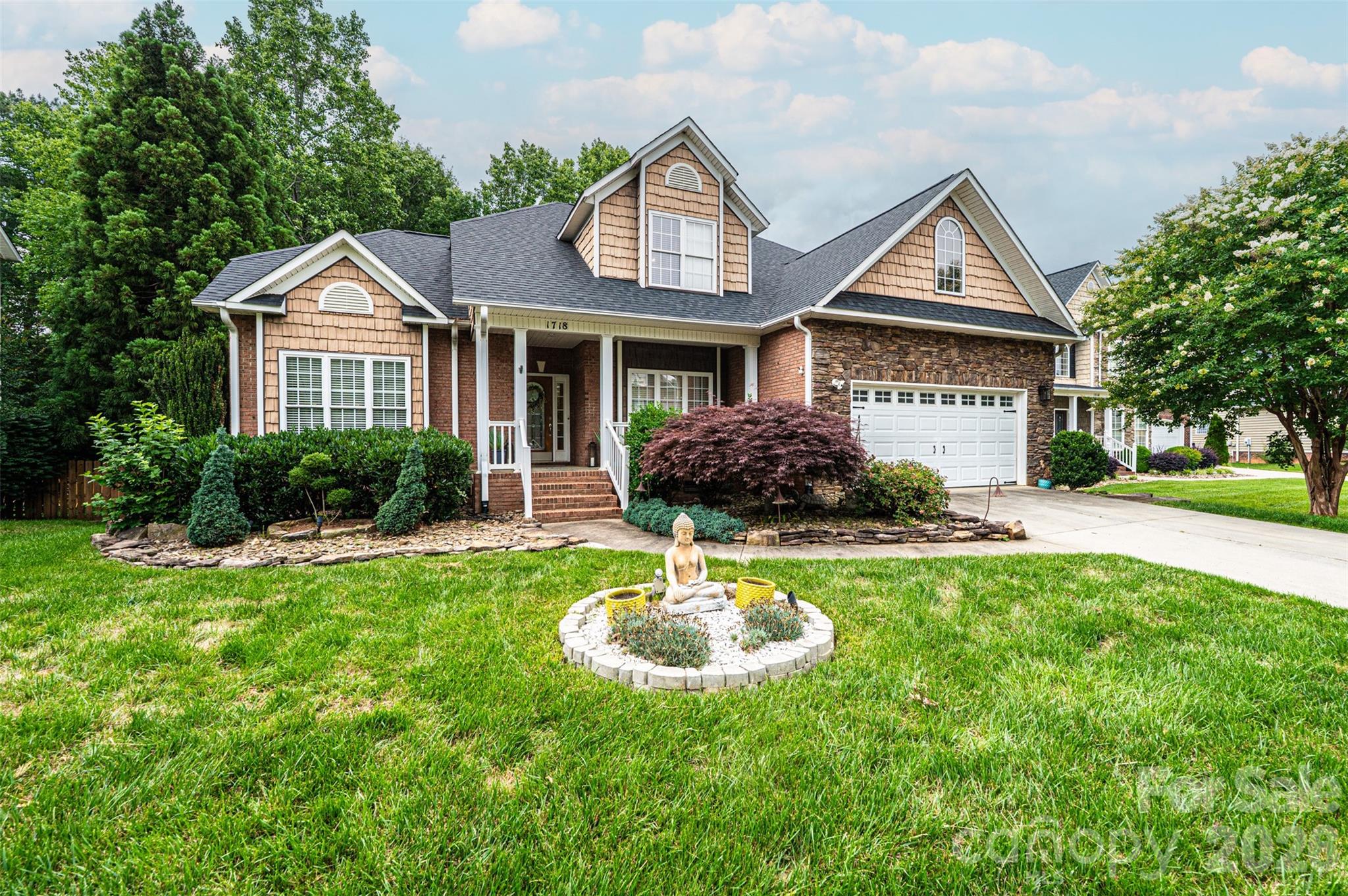 Elegant 5-Bedroom/3.5-Bathroom Lawsons Creek beauty with finished basement, main level primary suite and extensive updates! Offering the perfect blend of elegance, comfort, and functionality, this home is loaded with upgraded features including crown molding, chair railing, arched doorways, recessed lighting, hardwood floors & tray ceilings. Enter on the spacious covered front porch into the wide foyer and you are immediately met with the gorgeous living room windows with transom window tops w/clerestory effect illuminating the high ceilings! There is a formal dining room to your right loaded with chair railing, crown moldings, arched openings, and an octagon tray ceiling. The spacious main level primary suite provides a private retreat with a deep tray ceiling, crown molding, archway over jetted tub, step in tile shower, double vanity and walk-in closet. The main level kitchen and dining area are loaded with windows & doors to rear deck for tons of natural light! The kitchen has been updated with all new paint, including cabinets, 2 year old Elec range and microwave, and a built-in desk area with upper cabinetry. The staircase to the upstairs has been freshly painted to highlight its scroll iron balusters. Upstairs features 3 good sized spare bedrooms, all with ceiling fans, and a full hall bathroom with a double vanity. The finished basement is ideal for entertaining, featuring a new built-in entertainment center in the den with a built-in electric fireplace. There is a separate game room complete with a see-through gas-log fireplace into the basement bedroom. The basement is complete with a full bathroom, hallway and storage! Recent updates (past 2 years) include a new roof, new 2nd floor HVAC unit, bsmt built-in entertainment center, complete interior painting, new water pump and shelving/storage cabinets for the main level garage. Schedule your showing today and experience all this exceptional property has to offer!