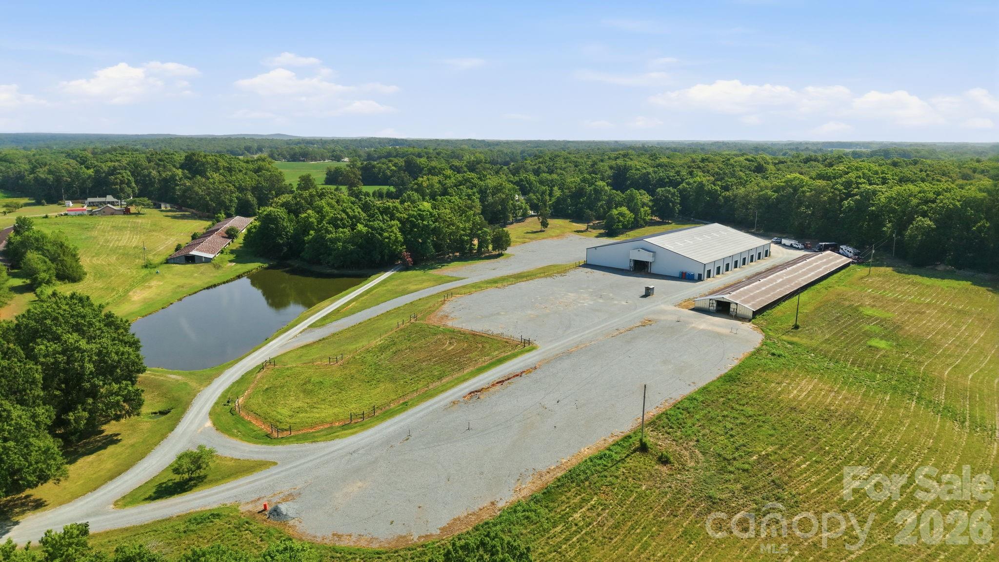 Welcome to an exceptional 37.81 acre private estate designed for luxury country living, equestrian excellence, and premier rodeo events. Tucked behind a gated entrance, this one-of-a-kind property offers privacy, functionality, and outstanding amenities for horse enthusiasts, competitors, or anyone seeking a remarkable rural retreat.

The beautifully appointed 5-bedroom, 5-bathroom farmhouse combines timeless charm with modern conveniences. Inside, you'll find gorgeous hardwood floors, a spacious bonus room perfect for entertaining or flexible living, and a tankless water heater for endless hot water. The thoughtfully designed floor plan provides ample space for family, guests, or multi-generational living.

Equestrian facilities are second to none. The impressive horse stable includes an apartment above, making it ideal for guests, caretakers, or rental potential. The barn features six oversized 14' x 14' foaling stalls, all fully covered with durable rubber mats, a heated and cooled tack room, a convenient wash bay, and energy-efficient LED lighting throughout.

The property's crown jewel is the professionally designed, approximately 32,000-square-foot working rodeo arena. Built to accommodate competitions and events, it features new bleachers, new arena panels, an LED barrel and pole overhead timing system, an announcer's booth with a new sound system and heating and cooling, massive 24-foot Big Ass Fans for comfort, and LED lighting throughout the entire facility. A concession stand completes the venue, making it ready to host rodeos, barrel races, team ropings, clinics, and other equestrian events.

The land is equally impressive, offering fenced pastures ideal for livestock and horses, along with a stocked fishing pond that provides the perfect place to relax after a day on the ranch.

Whether you're looking for a private family estate, a professional equestrian facility, or an income-producing event venue, this extraordinary property delivers an unmatched combination of comfort, performance, and opportunity. Properties with this level of infrastructure and versatility rarely become available—don't miss your chance to own this incredible country estate.