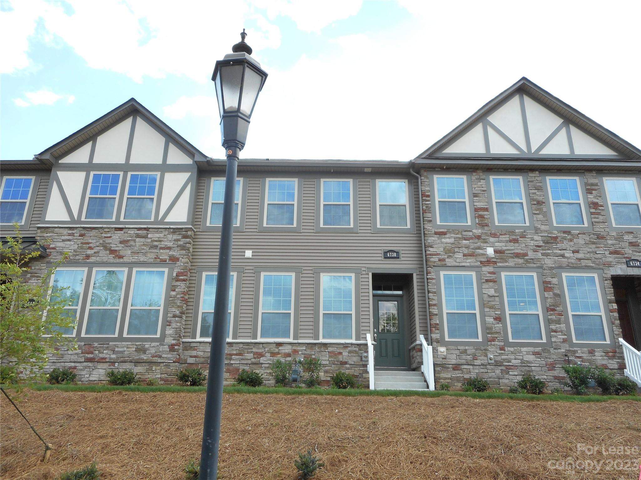 Beautiful executive townhome in Southwest Charlotte. 3 bedrooms, 2.5 Baths with Loft and big 2 car garage. Coffee Bean hardwoods on main. Fireplace in great room. Sweet granite counter tops with stainless appliances and lovely backsplash. Plenty of cabinets and counter space along with breakfast area. Huge deck. Washer and dryer included. Across the street from massive pool and playground complex. Close to lots of shopping. Minutes to Airport, Lake and 485.