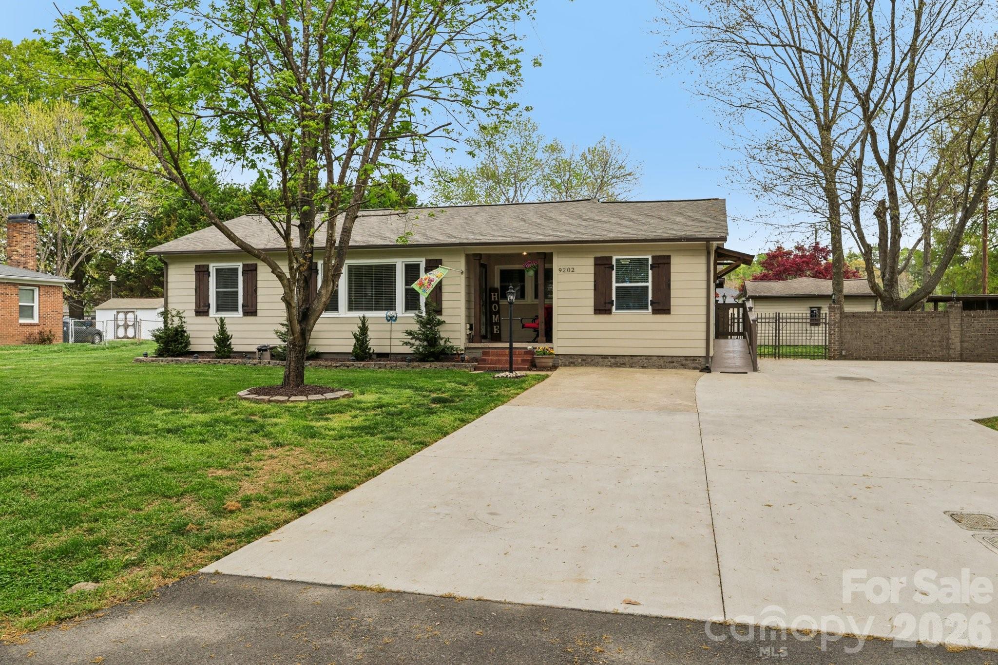 Beautifully updated Charlotte home with NO HOA — a rare find that gives you the freedom and space buyers are craving. Situated on a spacious lot, 9202 Elgin Drive offers the perfect mix of comfort, privacy, and convenience just minutes from everything Charlotte has to offer.
Inside, you’ll find a warm and inviting layout featuring tray ceilings in the living room, three bedrooms, and two recently renovated bathrooms. The kitchen has been updated with modern appliances, while the oversized laundry room adds extra functionality and storage space. Big-ticket updates are already done for you, including all new flooring throughout, a brand-new roof, and new HVAC system in 2024.
Step outside and this property truly stands out. Enjoy your morning coffee on the welcoming front porch or unwind in the fully fenced backyard complete with a brick privacy wall for added seclusion. The covered outdoor living area with three roll-down shades creates the ultimate setup for relaxing or entertaining year-round. Need extra space? You’ve got it — with two powered sheds perfect for hobbies, storage, or workshop space. And yes, there’s even an air-conditioned dog house that may just steal the show.
Location is the cherry on top — conveniently located near I-485, CLT Douglas Airport, the U.S. National Whitewater Center, and just 8 miles from Uptown Charlotte.
Space, upgrades, privacy, and no HOA restrictions? That combination is hard to come by — and this home delivers all of it.