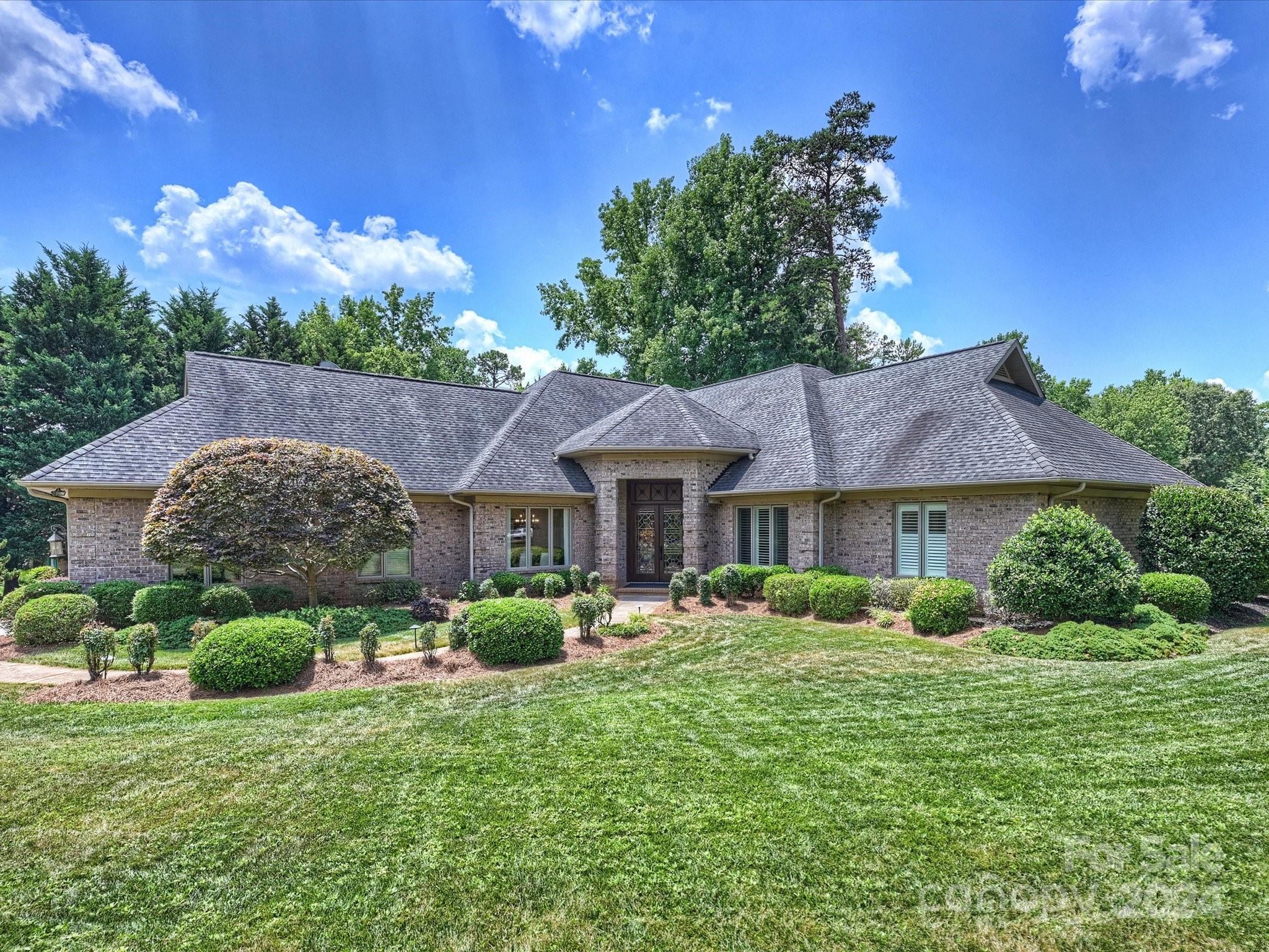 Welcome to the beautiful, gated waterfront community of River Hills. This magnificent custom-built full brick home will have you impressed from the moment you arrive. Entering the home through the marvelous 8ft beveled glass double doors you will be greeted by remarkable newly refinished walnut hardwood floors, plantation shutters and an abundance of natural light. Crown moldings, coffered ceilings at 10ft to 12ft in height. Open kitchen with double ovens, walk in pantry, stunning cabinetry, office area with built in desk, breakfast/keeping room with gas F/P leading to an expansive screened in porch. The family room offers a beautiful stone mantel F/P and elegant seating. The primary suite is simply, fantastic with expansive closets and doors to the screen porch. Secondary bedrooms are spacious and can easily accommodate king beds. Upstairs bonus/bedroom with a full bath and several attic storage areas. Located on a private circle street with gorgeous homes, truly a remarkable home.