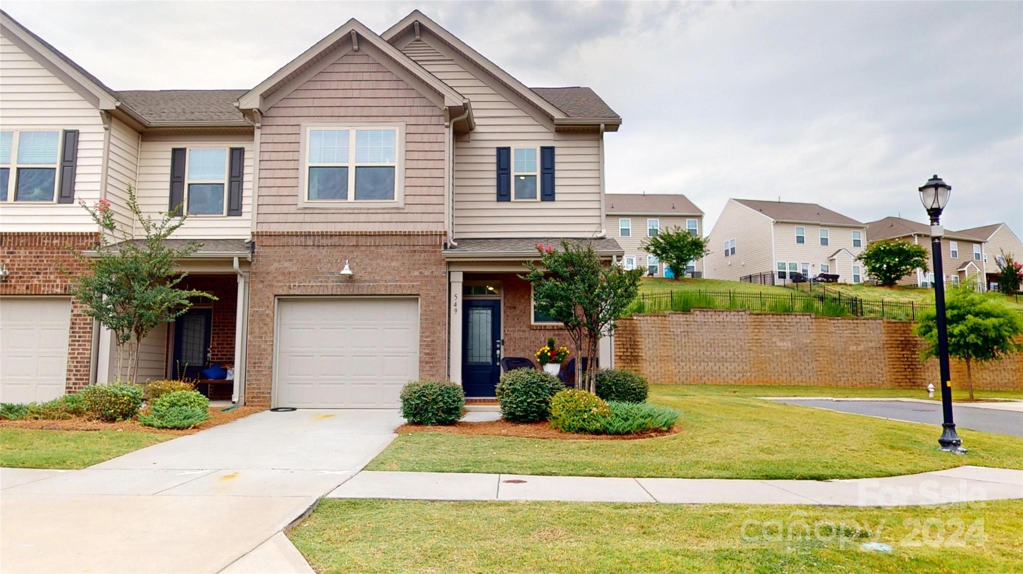 Just Listed- A coveted 3 bed, 2 ½ bath end unit townhome in the amenity rich community of Waterside at the Catawba in Fort Mill, SC. 549 Common Ravens Ct is rare beauty with the extra side lawn, on a cul de sac, & across from the community green space. Enjoy the finishes & updates you love like high ceilings, Luxury Vinyl Plank flooring, quartz countertops, cozy gathering room gas fireplace, matte black hardware, designer lighting & a custom built-in breakfast nook with added storage. On the second floor you have the primary en suite with tray ceiling, counter height dual sinks, tiled shower & separate soaking tub. The split bedroom 2nd floor offers spacious secondary bedrooms, tiled bathrooms & lots of storage in closets! Relax on your front porch overlooking the green space, or your private back patio. Community amenity center offers clubhouse, swimming pool, tennis courts, playgrounds & walking trails. SS Fridge conveys. 1 Yr APHW with acceptable offer. Book your showing today!