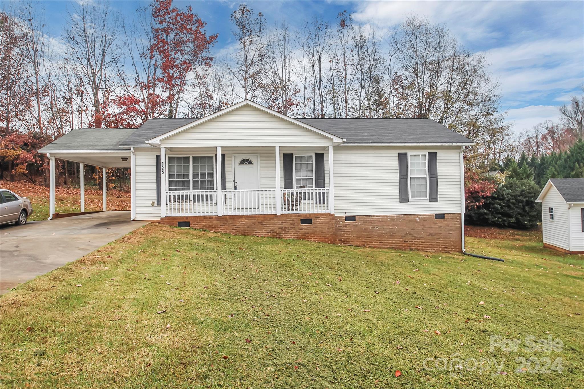 Great starter home priced to sell.  This 3 bedroom, 2 bath ranch home is perfect for your first home, downsizing or investment.  Add your personal touches and make it home. Private backyard, covered front porch and single car attached carport. Conveniently located to downtown KM, schools and easy access to I85. Home sells as is.