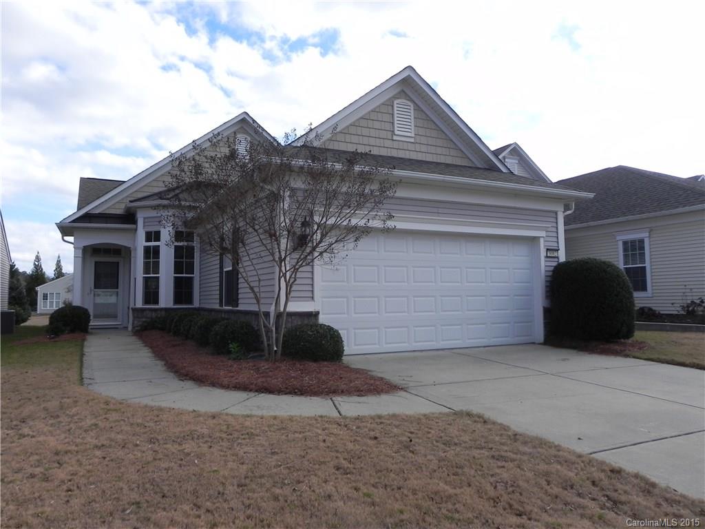 This 2BR/2BA Gray Myst with an office & sunroom is located in The Arbors (Pod A) in the front of the community.  It is walking distance to the Amenity Center, Shopping & walking trails.  It features hardwoods in the kitchen, foyer and sunroom, Corian counters, tile backsplash, stainless appliances, electric stove and kitchen desk. There is a sola-tube in the guest bath, ceiling fans, blinds/shades, storm door and finished garage.  This home is move-in ready!