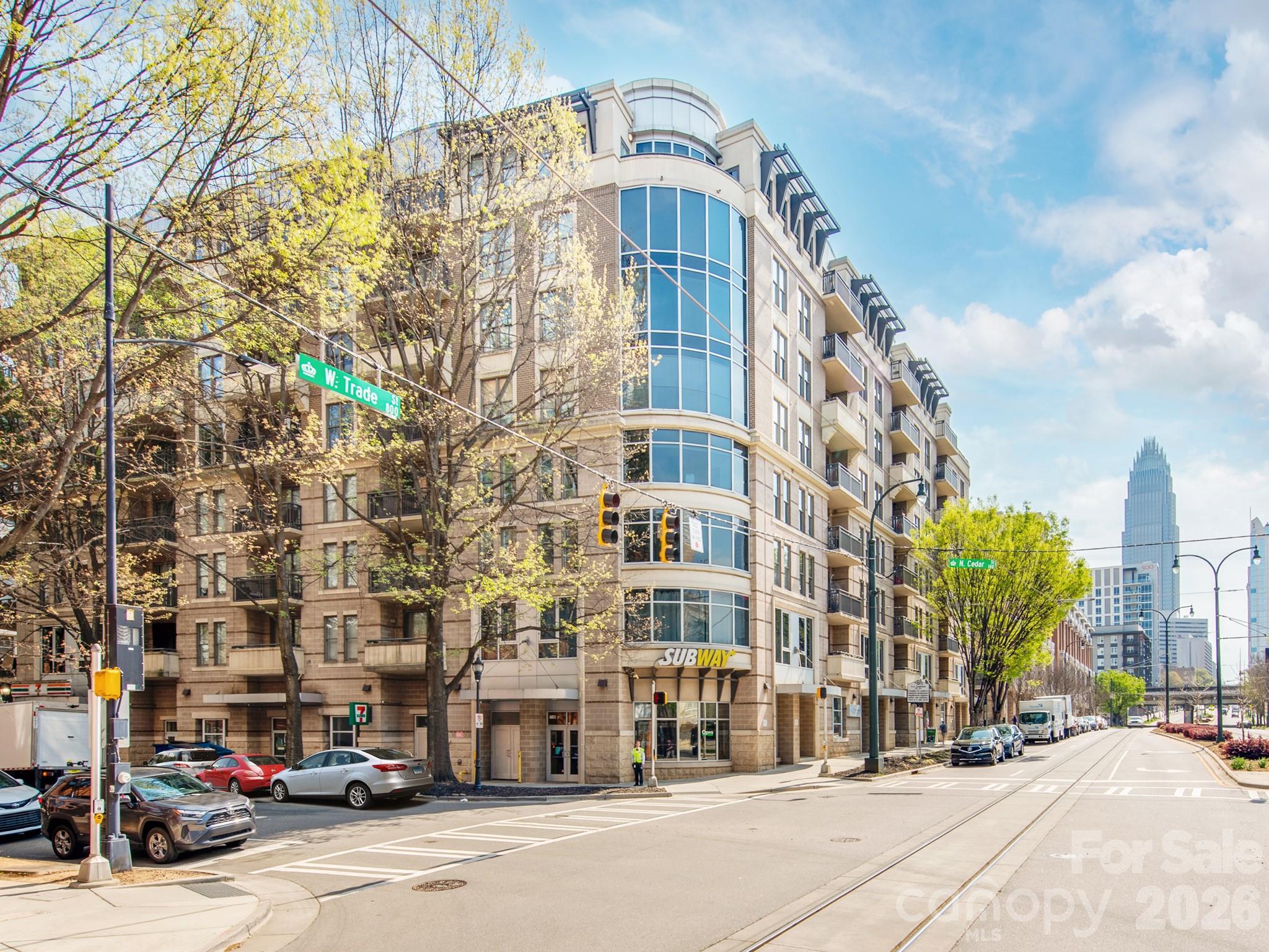 Amazing uptown city views from this 4th floor spacious condo.This 2 bedroom, 2 bathroom split level w/ a large balcony is a must see. Open concept floor plan w/plenty of natural light throughout. The kitchen offers black/SS appliances,updated granite countertops & a large island bar area perfect for entertaining.Off the kitchen you will find a nice size dining area & large family room w/ gas fireplace leading to the outside balcony. The primary bath has dual vanities & a huge walk-in-closet.Large bedroom on the other side of the unit w/ 2nd full bathroom. Amenities galore, Inground pool on main,exclusive rooftop terrace with full set up & lounge area w/ fob access to a full kitchen,grills & entertainment. Gated +fob security & (( 2 )) designated parking spaces 4th floor parking deck # 94 & 95.Great walkability to Uptown for work, restaurants,shopping, Truist Field- baseball stadium,BOA stadium, Filmore, blumenthal performing arts + so much more & all right outside the complex.Easy Interstate Access to (I-77 & 85). Owner Occupied or Investors Welcome. (((Short term rentals allowed))).Please set up your showing today!