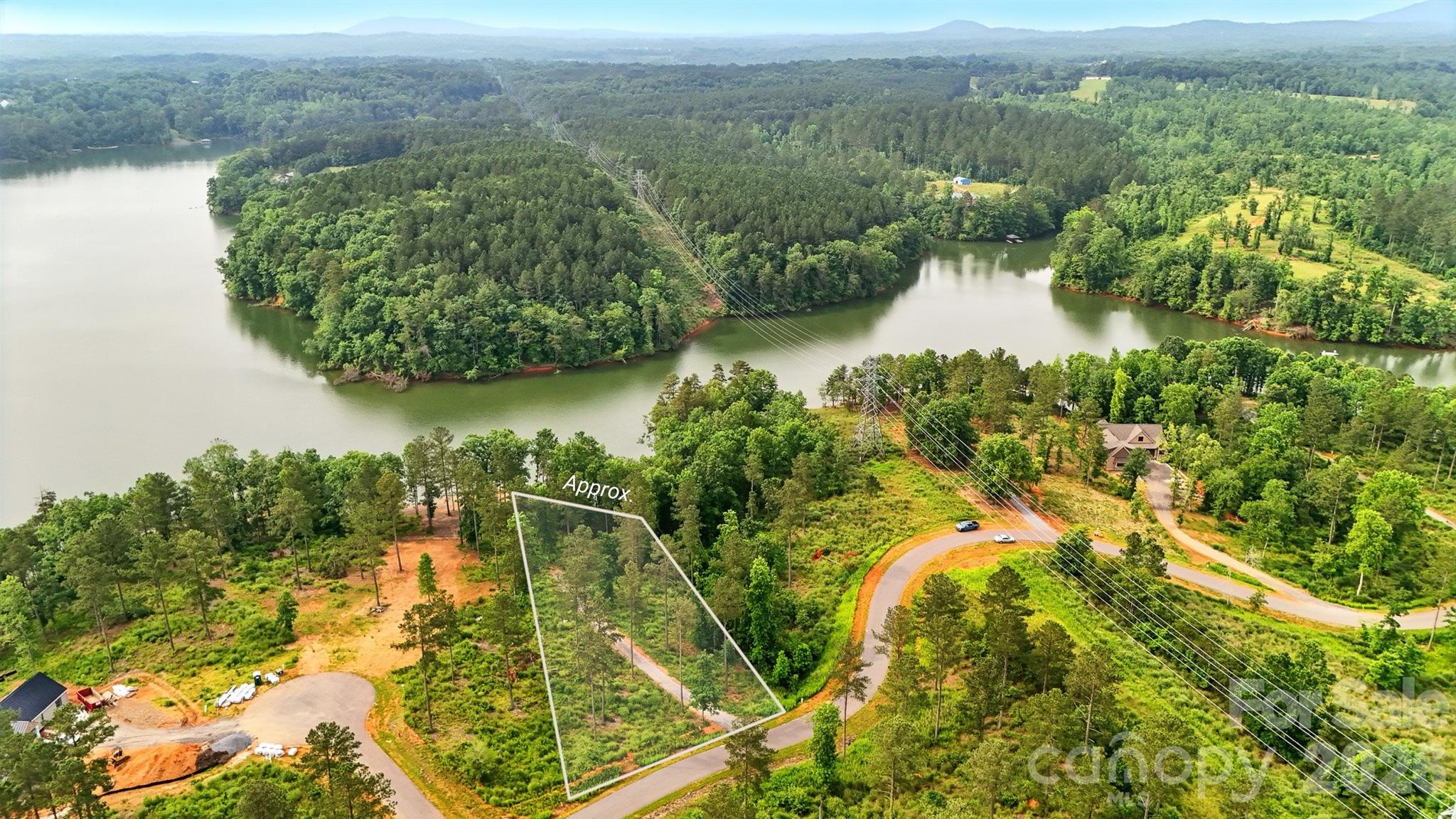 WATERFRONT DREAM BUILDING SITE WITH APPROVED PERMITS
Gated Community of Lakeside Reserve

Presenting a premier waterfront lot in the exclusive Lakeside Reserve, where your vision of a custom lakefront home is not just possible—it’s pre-approved. This exceptional property comes with the critical advantage of both a septic permit and a dock permit already secured, streamlining your path to construction and ensuring your private dock is part of the plan from day one.

Enjoy stunning, year-round water views from your future home, with a driveway already installed and full, permitted dock access ready for your boat. Imagine peaceful mornings watching the sunrise over the water and evenings spent boating or fishing directly from your own backyard.

Beyond your private paradise, Lakeside Reserve offers resort-style amenities:

Resort-style swimming pool

Pickleball courts for friendly competition

Scenic walking trails through natural surroundings

This is a rare opportunity to build your dream home without the permitting hurdles. Combining permitted practicality with breathtaking lakeside living in a secure, gated neighborhood, this lot is an opportunity that truly cannot be missed.