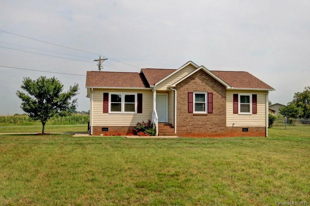 Great starter or investment property in great condition.  New roof 2009, newer appliances, new windows, freshly painted throughout, new carpet, wood flooring in living room.   Corner lot with large deck to enjoy rural living and the Statesville Balloon Festival.   16x16 2 story shed would be great storage or workshop.  Quiet community close to airport, Lakewood Golf Course, Troutman and downtown Statesville.