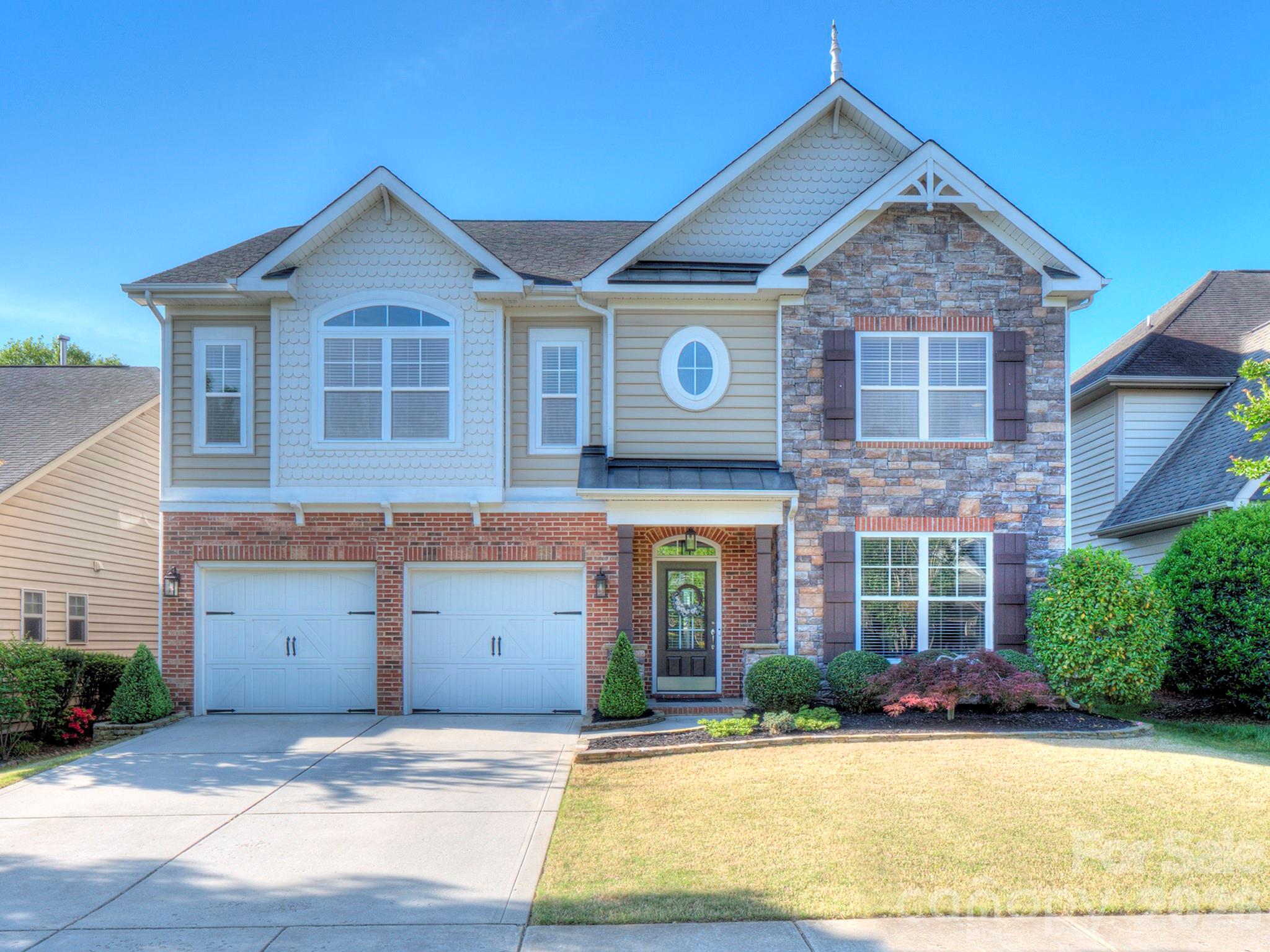 Thoughtfully updated and meticulously maintained, this rare 5 bedroom, 4 full bath home in sought-after Cureton offers space, function, and move-in ready convenience in one of Waxhaw’s most desirable amenity-rich communities. The open floor plan is ideal for everyday living and entertaining, featuring wood flooring throughout the main living areas, a spacious living room with trey ceilings and a gas log fireplace, and seamless flow into the updated kitchen with an oversized island, granite countertops, custom millwork, tile backsplash, and stainless steel appliances including the refrigerator.  A guest bedroom and full bath on the main level provide flexibility for visitors or a home office, while upstairs offers a huge loft space perfect for a second living area, media room, or playroom. The oversized primary suite features vaulted ceilings, a large walk-in closet, and a private en-suite bath. Additional updates include designer lighting (2025), 2” blinds throughout, and comfort-height toilets with soft-close features.  Major system updates bring peace of mind: upstairs furnace replaced in 2024, downstairs HVAC in 2019, water heater in 2021, and a whole-home water filtration system added in 2022. The kitchen island renovation (2021) added both style and functionality with new granite, sink, faucet, and dishwasher. Garage door systems were fully overhauled in 2025, and the garage is equipped with a Gladiator storage system.  Enjoy outdoor living in the flat, fenced backyard with professional landscaping and added privacy screening. Located in Cureton, residents enjoy community amenities including a pool, clubhouse, walking trails, and convenient access to shopping, dining, and top-rated schools. A well-cared-for home with meaningful updates in a prime Waxhaw location.