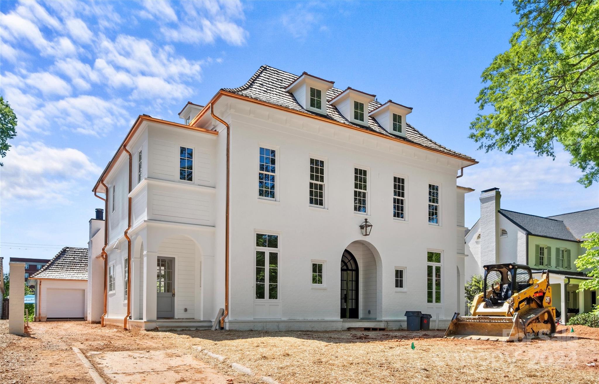 LUXURY LIVING IN MYERS PARK!  This custom home, built by Knight Residential Group & designed by Aaron Cote Architecture, exudes luxury & sophistication.  Desirable floorplan for effortless entertaining & everyday living.  Show-stopping chef's kitchen with island, walk-in pantry, drop zone & wet bar opens to dining area & fireside living room.  Main level primary suite with ensuite bath features two vanities, soaking tub & large closet with hook-ups for washer & dryer.  Lounge & study on main.  Four additional bedrooms with ensuite baths, flex rm, rec area, laundry rm & half bath, upstairs.  Continue entertaining outdoors on covered porch with fireplace overlooking patio, pool & enclosed (brick wall) backyard.  Sixth bedroom & full bath plus a bonus room & loft on third level.  Detached two-car garage.  Note:  Home will be painted white brick with cedar roof.  Convenient to shops & restaurants in Myers Park area & easy commute to Uptown.