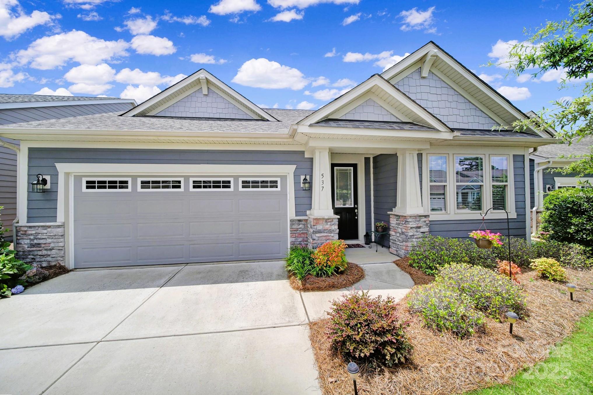 Welcome to easy, elevated living in Tega Cay! This immaculate home offers style, space & low-maintenance comfort, all nestled in a vibrant community w/ lawn care included. The heart of the home is a designer kitchen that impresses w/ granite countertops, gas cooktop, upgraded white cabinetry, a spacious island, wall ovens & custom vent hood. Enjoy seamless flow through the open-concept main level, where natural light pours in & highlights the spacious living & dining areas. Primary suite boasts incredible walk-in doorless shower & dual sinks. Step into the new 3-season room, perfect for relaxing year-round w/ peaceful views of the expansive green space just beyond the backyard. No rear neighbors, just open serenity. Upstairs, guests will love their private retreat complete w/ a large bedroom, full bath & a versatile loft/bonus room. Situated in one of Tega Cay’s most desirable communities including a neighborhood pool & park near Lake Wylie with the ease of a lock-and-leave lifestyle.