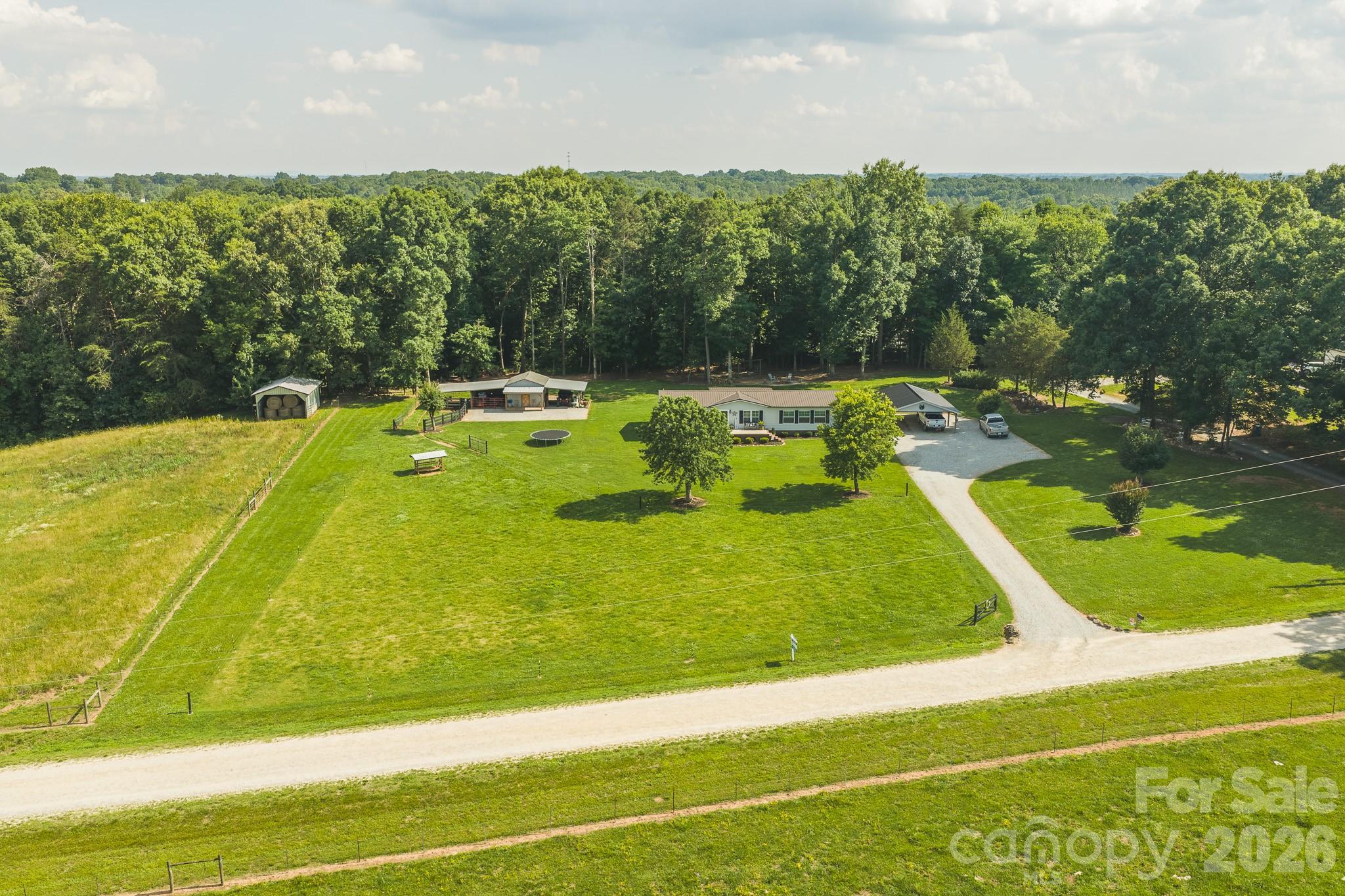 Dreaming of a small homestead? Skip the setup and start living it. Fenced pasture, livestock shelter, powered storage building, public water, and room for gardens, goats, and chickens—the groundwork is already in place at 441 Fairgrounds Road in the Wittenburg Community.

This well-maintained 3-bedroom, 2-bath home offers over 1,700 square feet of comfortable living space and sits on level, usable land that's ready for your next adventure. Whether your plans include a large garden, a few farm animals, or simply more room to spread out, this property provides the flexibility to make it your own.

The fenced pasture is currently home to goats and includes a livestock run-in shelter, while the large storage building with power offers excellent space for equipment, tools, feed, hobbies, or a workshop. Much of the work has already been done, allowing you to focus on enjoying the lifestyle rather than creating it.

Outside, you'll find a spacious front porch, covered rear porch, and an expansive covered deck overlooking beautiful landscaping and an ornamental pond that provides a relaxing backdrop for morning coffee or evening gatherings. The spacious backyard features a fire pit area, room for play, and plenty of open space to enjoy.

Additional features include a detached carport, public water service, and a state-maintained gravel road that provides a tucked-away setting while remaining convenient to town. The property may also offer the potential for a future homesite, subject to applicable approvals, or continue to be enjoyed as pasture and open space.

Major appliances convey, and some furnishings will remain, making this move-in-ready property even more appealing. If you've been searching for a place where you can raise a few animals, grow your own food, and enjoy a little extra elbow room, this one deserves a closer look. $324,900  Showings begin June 11th!