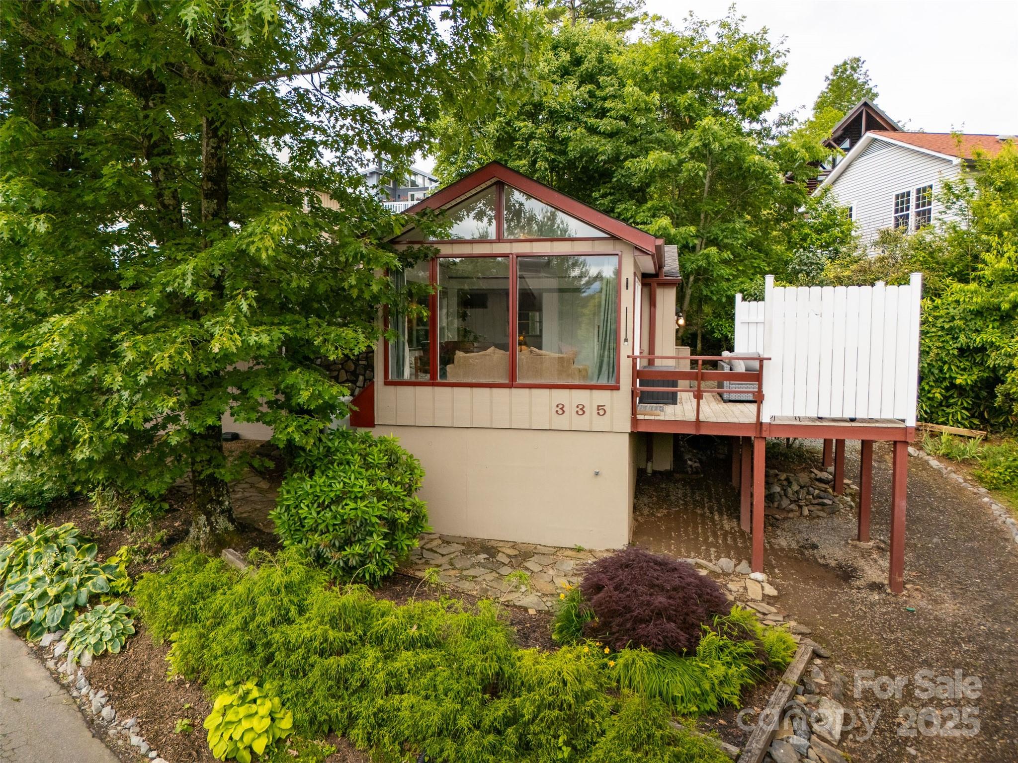 Linville Living with Grandfather Mountain Views! Charming 2BR/1.5BA cottage, open-concept layout with oak cabinetry, stone gas fireplace, and sunroom/dining area overlooking seasonal mountain views.  This property is rental-ready with a history of steady income. Comes fully furnished with a washer/dryer, generator hookup, golf cart & crawlspace storage and a large sun deck to soak up the crisp mountain air. Enjoy resort-style amenities: pool, golf, pickleball, tennis, fishing, lake/river access with kayak launch, hiking trails, clubhouse with weekly events/live music, and 24/7 neighborhood law enforcement. Short distance to clubhouse, Patio Grille, and steps from the golf course. Don’t miss this perfect mountain retreat!