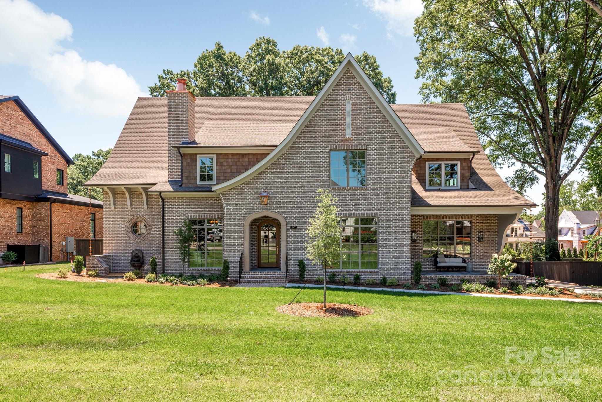 Stunning custom home on a rare flat 1/2 acre lot in the Cotswold neighborhood. This luxurious home is curated with gorgeous "must see" selections, fixtures, and finishes. The main floor primary bedroom suite has vaulted ceilings and a spa like bath. Five bedrooms total, along with a large bonus room, family room and study with fireplace. Thoughtfully designed kitchen is perfect for at-home chefs or for prepping quick and simple meals alike. Storage galore with walk in scullery, butler's pantry and drop zone. Abundant outdoor living areas include a large screened porch with fireplace and outdoor kitchen, a festive cocktail porch off the beautifully wood paneled dining room, and a reflection garden with a relaxing fountain. Don't miss this gorgeous new construction home, expertly crafted and energy efficient by THR Design Build. Conveniently located close to Cotswold shopping and dining, this home is the perfect blend of luxury and comfort and ready for you.