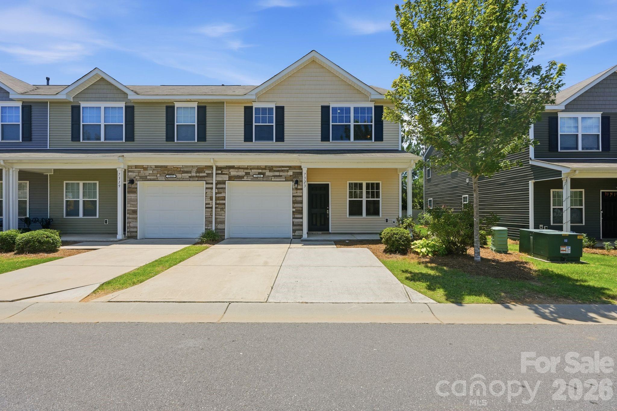 Don't let "2-bedroom" fool you — this End Unit McDowell Crossing townhome lives like a 3-bedroom, thanks to a versatile flex room and loft that most comparable 2BR homes simply don't offer. This beautifully refreshed, move-in-ready home gives you the flexibility to create a home office, guest suite, playroom, or media room—without sacrificing the open, low-maintenance layout you want.

The main floor plan offers 2 spacious bedrooms and 2.5 baths, with fresh interior paint and a newer refrigerator, washer, and dryer so you can move in with confidence. The kitchen shines with a sought-after gas range making meal prep both easy and enjoyable. Upstairs, the additional loft and flex room give you the extra square footage and functionality buyers typically pay a premium for in a 3-bedroom layout—without the added cost.

Set on one of the community's most desirable corner homesites, this home enjoys extra natural light, added privacy with just one adjoining neighbor, and a more spacious feel. Step outside to a fully fenced backyard with an extended concrete patio—ideal for grilling, relaxing, entertaining, or giving pets a secure space to roam. A two-car driveway offers convenient parking, and the community pool is just steps away.

The HOA covers exterior maintenance and water service, so you can spend less time on upkeep and more time enjoying Charlotte. Whether you're a first-time buyer, busy professional, frequent traveler, downsizer, or investor, this home delivers the lock-and-leave convenience—plus the flexible space—that's increasingly hard to find.

Location is a standout: the 41X Express Bus to Uptown Charlotte stops right at the community entrance, and the LYNX Blue Line, I-77, I-485, and Charlotte Douglas International Airport are all just minutes away. Costco, Publix, Walmart, Lowe's, and countless restaurants make daily errands effortless, while Ayrsley Town Center, Carowinds, Topgolf, McDowell Nature Preserve, and Atrium Health Steele Creek keep shopping, dining, recreation, and healthcare close to home.

This house offers the space, flexibility, and value of a 3-bedroom home—in a low-maintenance, 2-bedroom package—in one of Charlotte's fastest-growing areas.