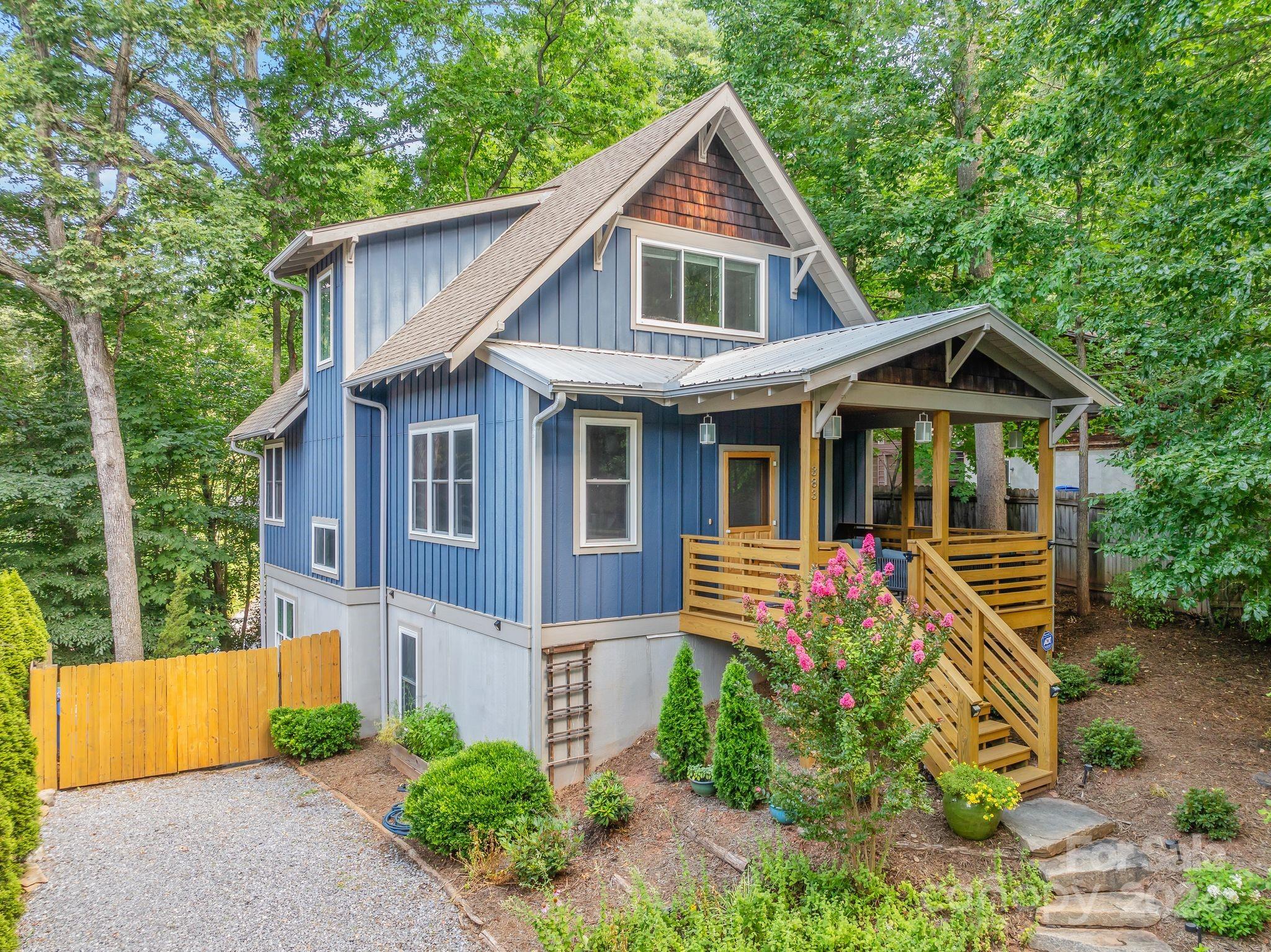Come home to this meticulously maintained, green-built JAG construction set across from a wooded lot in the heart of sought-after Montford. Walkable to neighborhood restaurants, parks, and downtown Asheville, this bright and airy 4/3 features an open concept kitchen/dining/living with bedrooms on the 2nd floor and basement levels. Several recent upgrades include: main floor den with artful built-ins, basement level "flex" space with separate entrance and built-ins, and exterior staircase connecting the upper back deck to lower patio. Whether enjoying the serenity of an elevated life among the trees, or entertaining between the deck, patio, and fire pit in your private, fenced-in backyard, this home is sure to delight! Please note: this home is located outside of HRC regulation.