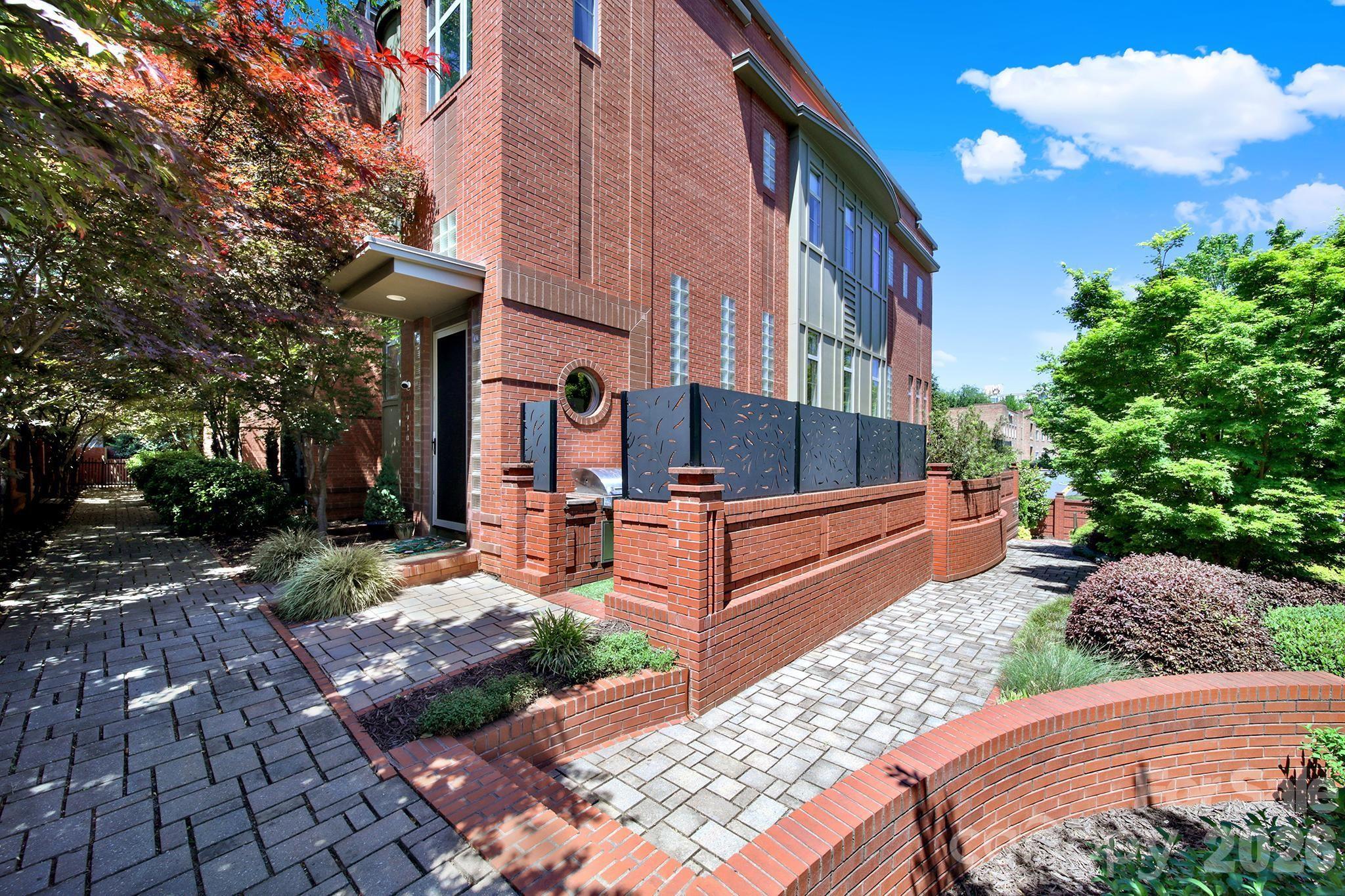 End-unit townhome with no HOA! Perfectly perched in in the heart of historic Dilworth Charlotte’s most desirable neighborhood.

Spanning 2,800+ square feet across four levels, the airy residence is defined by elegant white oak hardwoods, 10-ft ceilings, and a chef’s kitchen featuring a premier Italian range and a whole-house water filtration system. The sun-drenched great room offers a warm welcome, while a soaring 19-ft barrel-vaulted ceiling crowns the primary suite. This retreat includes ample custom closets and specialized storage space.

For the ultimate urban escape, a private loft leads to a 400 sq ft rooftop terrace with sweeping canopy and city views. This immaculate home features three outdoor living areas, a private courtyard, plus a two-car garage with premium poly-coat floors. Premier dining, boutique shopping, and the Light Rail are all within walking distance, keeping every essential convenience close at hand. This is not just a home; this is a statement.
