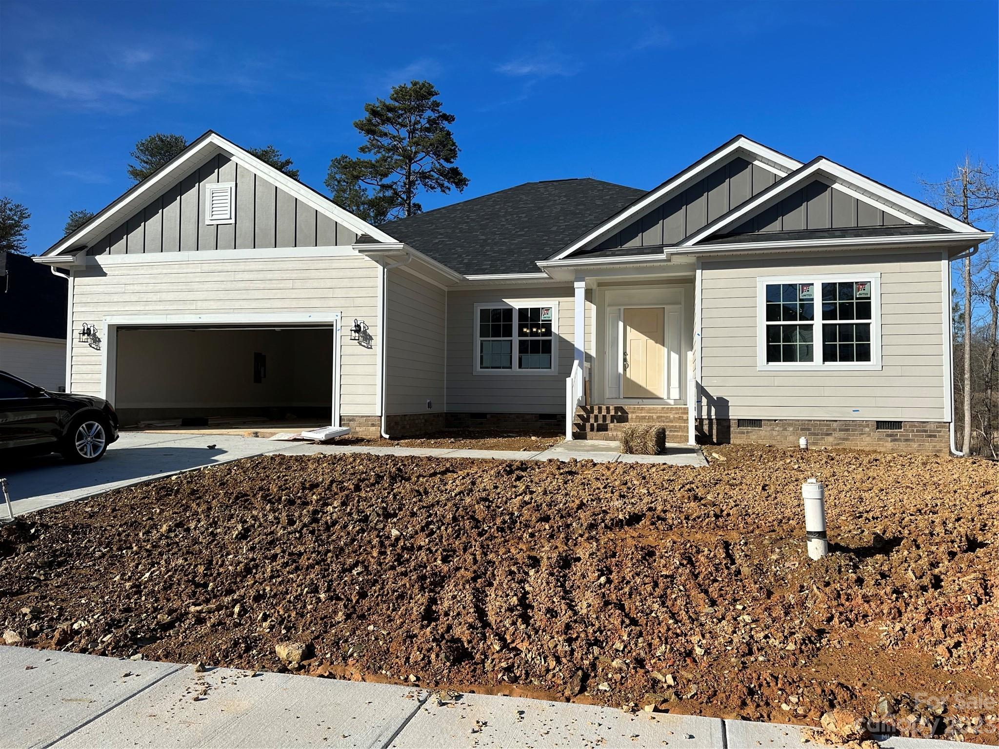 Only $1000 down to write contract! This new construction home is situated on Redbridge Golf Course in the beautiful town of Locust. This 2328vsf ranch is spacious & open with an incredible layout, great for entertaining. A cook's dream kitchen & large island overlook the spacious family room and gas fireplace. 4th bedroom/study with double door entrance lets in lots of natural light. Included in this home are granite countertops, tiled kitchen backsplash, stainless steel appliances, gas range, laminate wood flooring throughout the main areas and primary bathroom with 5' tile shower. Enjoy the golf course view from the 16 x 14 covered deck. Projected completion date December 2023. Home is awaiting landscaping. Closing costs paid with use of preferred lender.  All home features are subject to change without notice. A 2/1 rate buy down is offered on this home with 1st yr at 4.99% and 2nd yr thru 30th at 5.99% with use of preferred lender.  If rates drop lender will refi at no cost to you