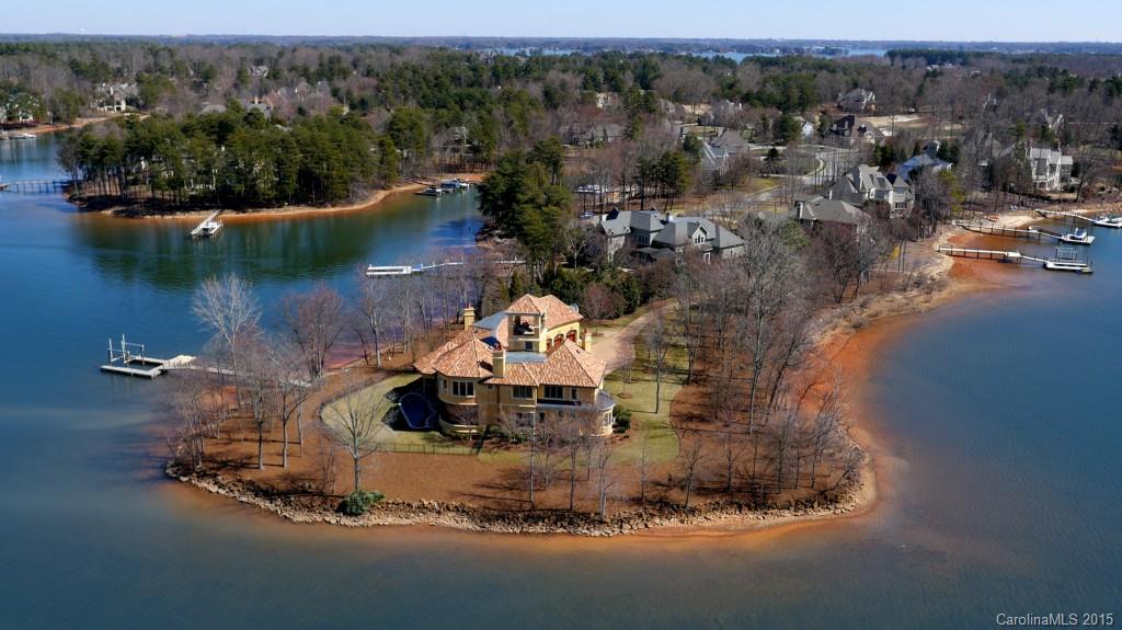 PRICE JUST REDUCED!!! Peninsula all to your own! A luxury many will look at, but only one can buy. This exclusive Lake Norman property has a 900ft shoreline that almost completely surrounds the estate. Driveway is privately gated and made from beautifully designed cobblestone. Spectacular panoramic views from crow's nest. 400g saltwater aquarium in stunning 3-story foyer. Luxurious marble and cherrywood floors. 2 Mastersuites, and 4FP. Personal dock w/electric boat lift and 2 jet ski slips.