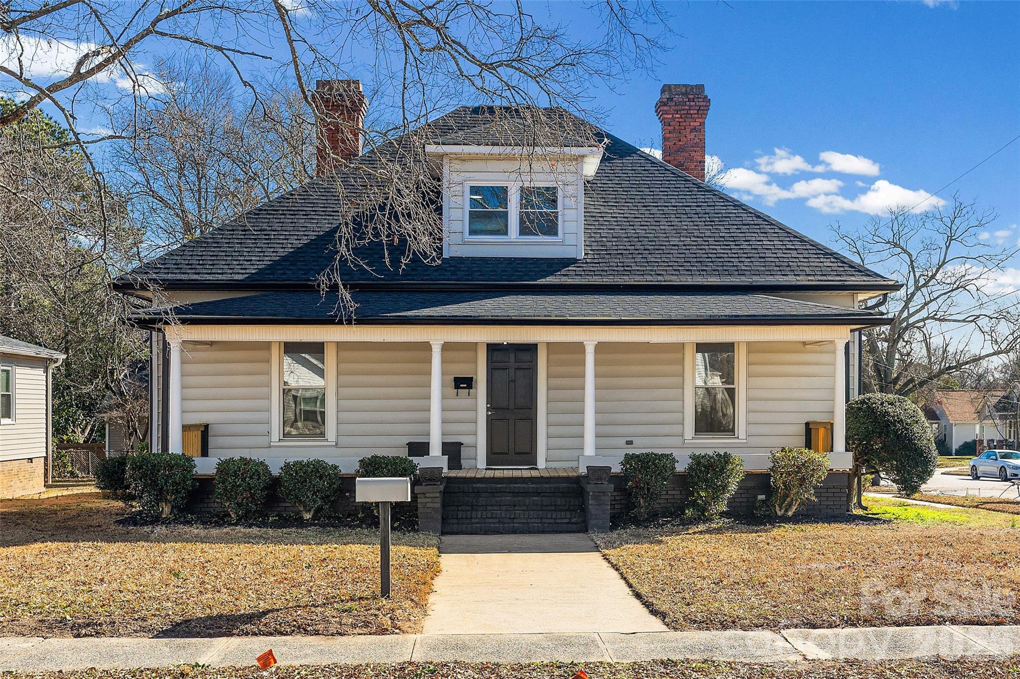 Imagine starting your morning on the classic rocking chair front porch, the quiet rhythm of the neighborhood waking up around you. This isn’t just a house; it’s a fully reimagined 2,800-square-foot retreat on a sprawling corner lot, offering a lifestyle of absolute freedom and modern elegance.

Space to Breathe, Room to Dream
Every corner of this total renovation invites you to live exactly how you’ve always imagined. With the possibility of six expansive bedrooms, you are no longer limited by four walls.

The Dual Primary Experience: Retreat to your choice of sanctuary with primary suites on both the main and upper levels—perfect for ultimate privacy or guest hospitality.

A Layout That Evolves With You: Finally have the dedicated space for a sun-drenched home office, a high-energy home gym, or a peaceful craft room where your creativity can run wild.

Warmth in Every Detail: From the rich hardwood floors to the sleek, modern kitchen, the home glows with the quality of a fresh start.

The Ultimate Creative Escape
For the visionary, the hobbyist, or the entrepreneur, the 683-square-foot detached garage is a dream come true. Featuring a fully wired workshop, it’s a place where sawdust flies and projects come to life—a rare sanctuary for those who love to build and create.

Your Gateway to Old Town Soul
Leave the car behind and embrace the vibrant energy of Rock Hill. Living here means you are just moments from the heartbeat of the city:

Savor the Local Flavor: Walk to dinner at Kounter, share a flight at Legal Remedy Brewing, or enjoy a slow Sunday brunch at The Flipside Restaurant.

Community & Connection: Spend your Saturdays at the Old Town Farmer’s Market, find inspiration at a local boutique, or find your zen among the blooms at Glencairn Gardens.

This is more than a home—it’s the backdrop for your next great adventure.