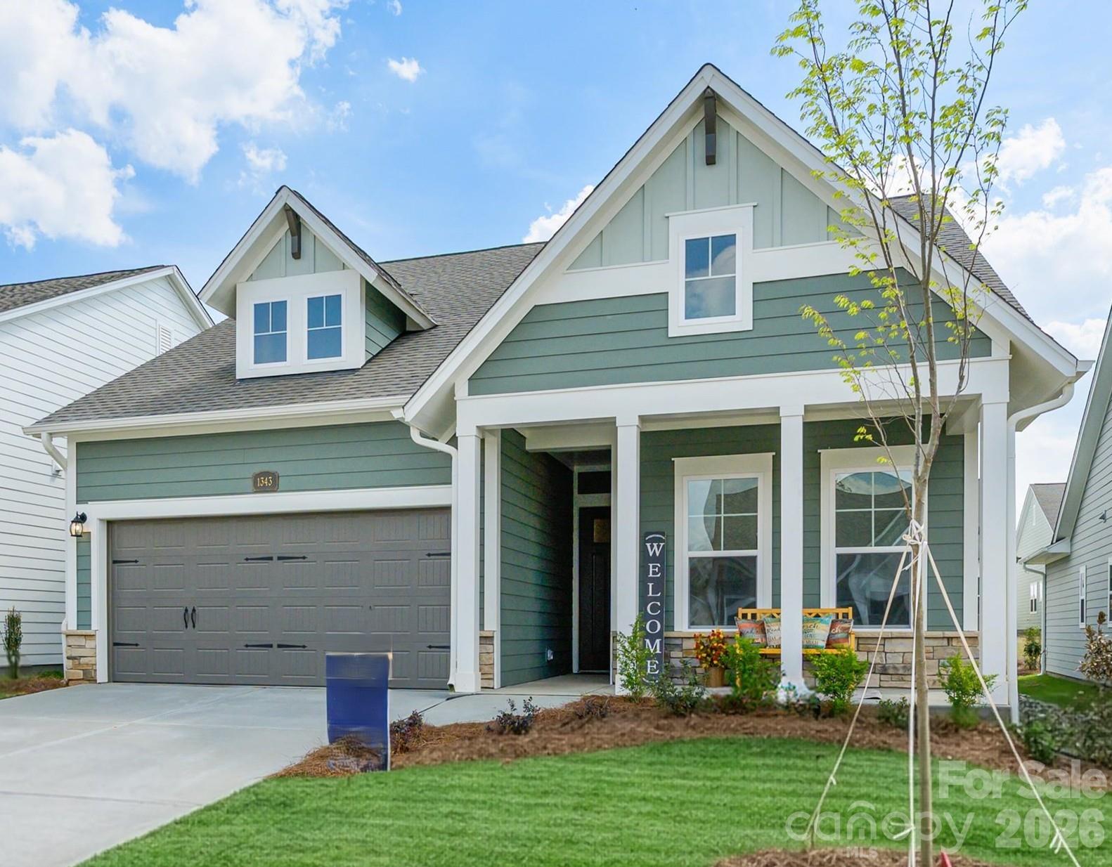 Experience the 55+ lifestyle in your new construction ranch home, in Waxhaw, NC!  This one-story home is designed with convenience and style in mind.   A gourmet kitchen, the heart of your home opens to the dining area and family room.    French doors provide for separation and light in the study.   A secondary suite is intentionally located at the front of your home allowing guests to enjoy privacy.  An oversized laundry room is complete with a countertop, sink, storage closet, coat closet and cabinetry!   Begin and end each day in a luxurious owner’s suite and spa-like bathroom.  Your covered porch is a wonderful space for enjoying the outdoors!  Move-in ready with blinds added!
