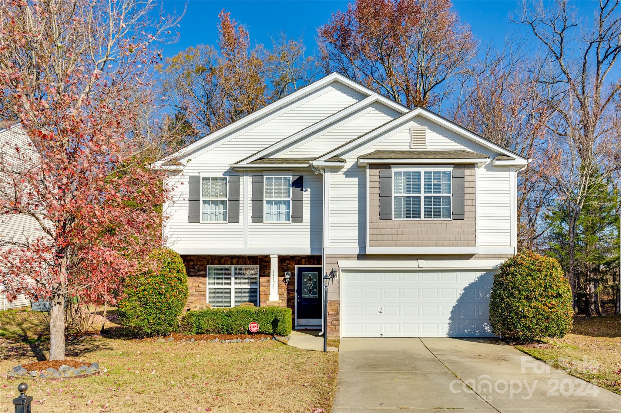 Welcome home to Waterlyn, located in the sought-after Steele Creek community, offering convenience to shopping, dining, & local amenities. This 4-bedroom, 2.5-bathroom home combines modern updates with comfortable living spaces. Inside, bamboo flooring enhances the main areas, & the bright, airy kitchen features stainless steel appliances. The formal dining room is perfect for gatherings, while the spacious great room with a gas fireplace provides a relaxing retreat. The large primary bedroom includes an ensuite with an updated shower, dual sinks, linen storage, & a generous walk-in closet. The three additional bedrooms also feature walk-in closets, offering ample space. Outside, relax on the large deck overlooking the fenced backyard with serene wooded views & an irrigation system for easy maintenance. Recent updates include an HVAC system installed in 2023 (dual zone) & a tankless water heater(2024). Community amenities include a clubhouse, pool, playground & trails.