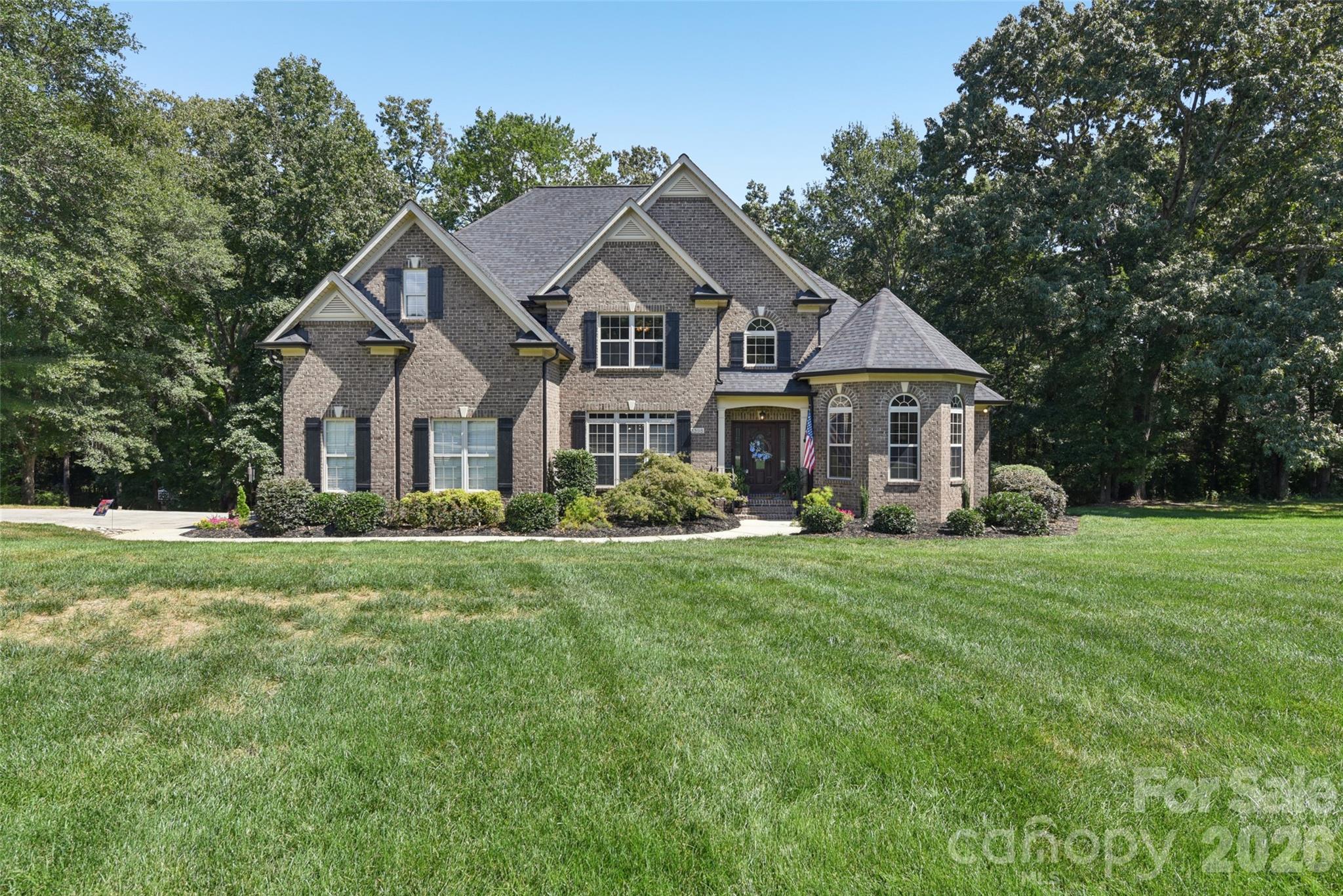 Experience luxury living in exclusive Millstone Creek on a private, meticulously landscaped 1.14-acre estate. Enjoy a perfect blend of elegance, tranquility, and convenience—just minutes from Waxhaw, Rock Hill, Lancaster, and Indian Land, with top schools, shopping, and dining nearby.

This custom-built residence welcomes you with a grand open floor plan, ideal for entertaining. The chef’s kitchen is outfitted with premium Jenn Air appliances—including a 4-burner gas range with convection oven and grill attachment—Bosch dishwasher, trash compactor, custom cabinetry, walk-in pantry, and full-size undermount stainless sink. The keeping room features a stone gas fireplace and custom built-ins, while formal dining, a dedicated office, and a spacious family room offer flexible living spaces. French doors open to a screened porch with 180-degree wooded views, seamlessly blending indoor and outdoor living. A separate grilling patio and landscape/security lighting create the perfect setting for gatherings.

Retreat to the main-level primary suite with a spa-inspired bath—Jacuzzi jetted tub, fully tiled walk-in shower with dual shower heads, dual vanities, and gorgeous “Rainforest” granite countertops quarried in India, plus Kohler fixtures. Upstairs: three additional bedrooms (septic permitted for 3), two full baths, and a versatile flex room ideal for a theater or gym. Additional features: Rinnai tankless water heater, dual HVAC, Moen faucets, 12-zone irrigation, septic alarm, laundry with sink and cabinetry, spacious drop zone, keyless entry, extra parking pad, and garage with keypad.

Recent upgrades: permitted 3rd full bath, plush new upstairs carpet (2025), upper HVAC, new architectural roof & gutter system (2024).

Enjoy unmatched privacy, luxury, and accessibility in one of the area’s most sought-after communities.

Note: Home has 4 bedrooms; septic permitted for 3 bedrooms (1000-gallon tank).