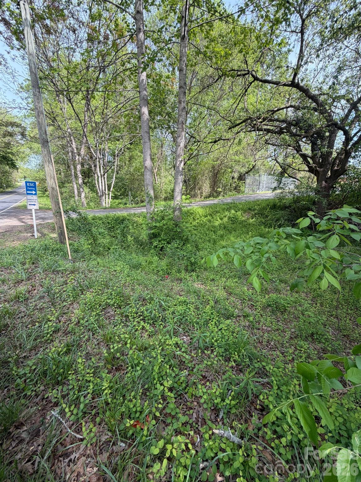 With a prime location near restaurants, shopping, and more, this +/- 0.14 acre wooded lot is full of potential for your future plans. Don't miss out on this opportunity to have a blank canvas that has endless opportunities. Schedule your showing today!