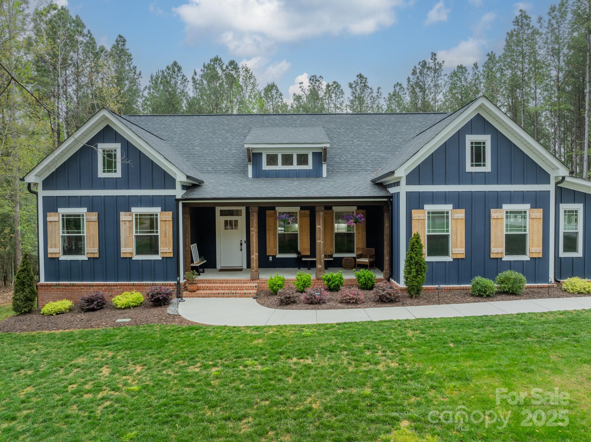 Impeccable Custom Home set on 1.61 Private Acres Along the Catawba River. Discover the perfect blend of modern conveniences & tranquility in this stunning 2-year old custom home situated on a flat, wooded 1.61-acre lot in beautiful Catawba Shores. This exceptional property offers privacy, premium craftsmanship & thoughtfully curated indoor & outdoor living spaces. Boasting 2,965 square feet of living space, this home features 9-foot ceilings, main-floor primary suite, gourmet open kitchen, vaulted ceilings & cozy gas fireplace. The 2nd level offers 2 large guest bedrooms w/ full bath. The attention to detail continues outside where you'll enjoy a rocking chair front porch, screened rear porch overlooking the expansive custom paver patio & peaceful wooded yard. For the hobbyist or car enthusiast, the attached 2-car garage PLUS detached 2-car garage/workshop w/ full power allows for limitless possibilities!  Close to Shopping and Restaurants, this well-cared for home will NOT disappoint!