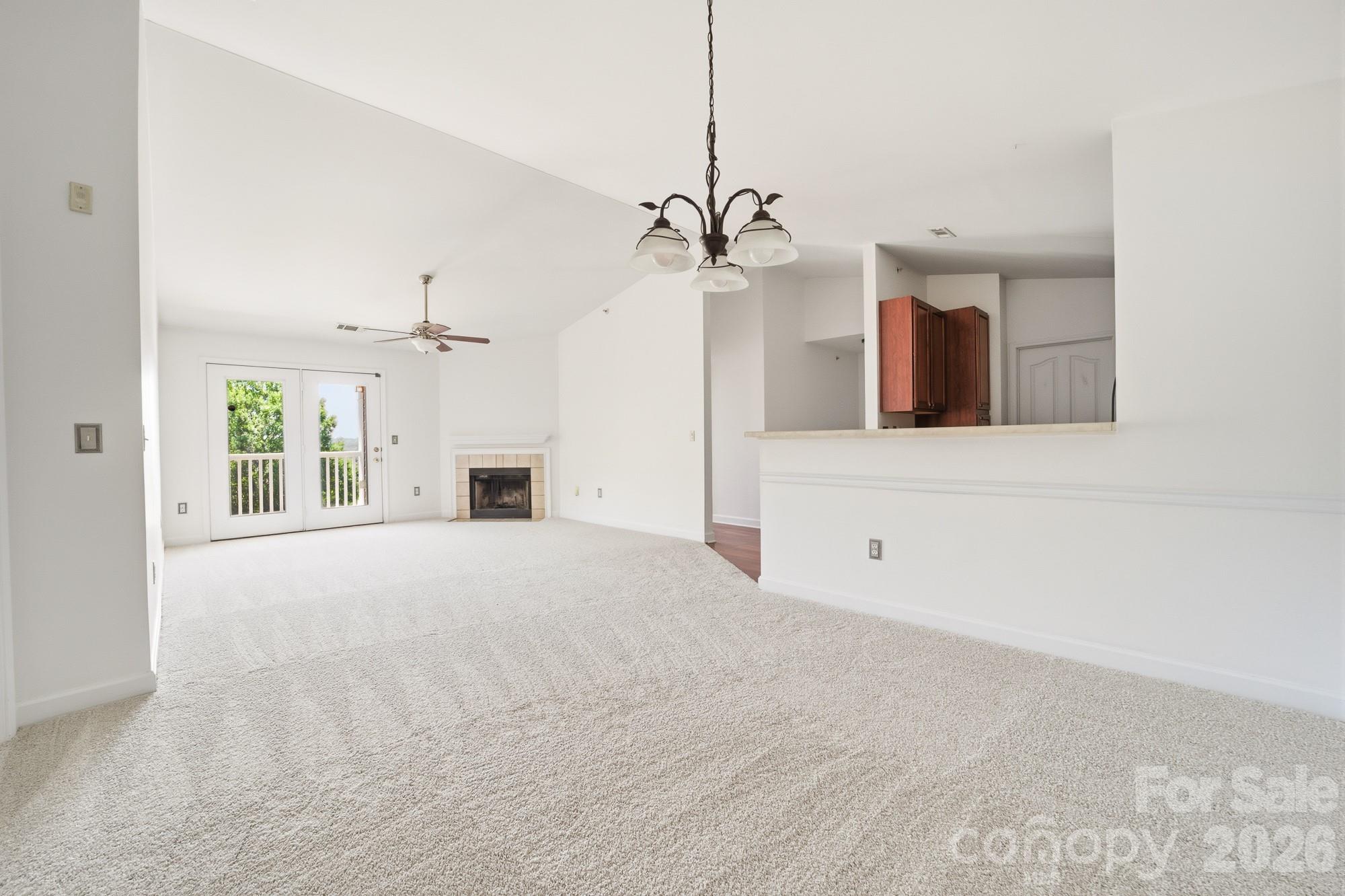 **PRICE REDUCTION** Do not miss this 3rd floor condo that's hitting the market! New carpet and fleshly painted interior makes this the condo to see. Being on the top floor allows the living room ceiling to be vaulted and being the end unit provides more windows which allows more natural light. This 2 bedroom, 2 bath, split bedroom floor plan also has a separate laundry room. Washer, dryer and refrigerator to remain with the unit. This property has large closets in the bedrooms along with an exterior covered deck and utility closet. Conveniently located near UNCC and I-85. Great location for investment purposes or UNCC students. HOA fee includes your trash, water, clubhouse, pool, gym & rec room. New HVAC unit installed in 2022. Near shopping and restaurants. A code is needed to enter the exterior door into the building that leads into the condo units. This provides additional security and peace of mind. If you are looking in this area, then this is a must see condo. Priced to sell quickly.