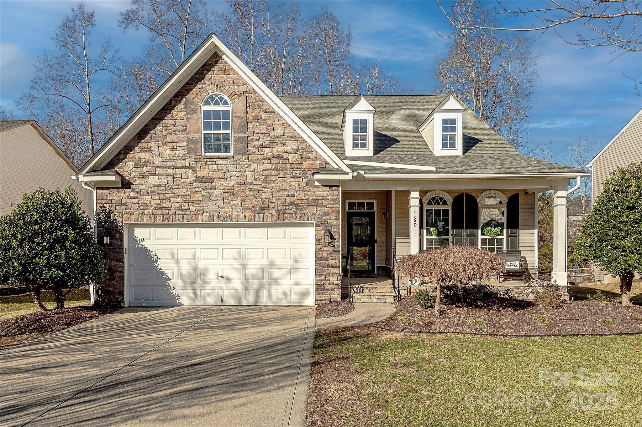 Situated on a wooded lot in the desirable community of Dominion Bridge, this primary on main has been updated to perfection. Rich finished hardwood floors unite the open floor plan. A grand 2-story great room provides natural light and flows seamlessly to the recently updated kitchen. The kitchen features 42" refinished white cabinets, top of the line stainless steel appliances, double wall oven and  convection cooktop and granite countertops. The primary suite features a tray ceiling, beautifully renovated bath with custom dual vanities, spa-like tile shower and amazing walk in closet. Flexible guest room also on main. Upstairs, a cozy loft leads to private bedroom #3 with en suite bath. Tons of entertaining and living options from the formal dining room, breakfast nook to sunroom overlooking the brand new deck. Fenced in yard backs up to natural area. Conveniently located near  shopping, dining and entertainment with award winning Fort Mill schools and minutes away from Ballantyne.