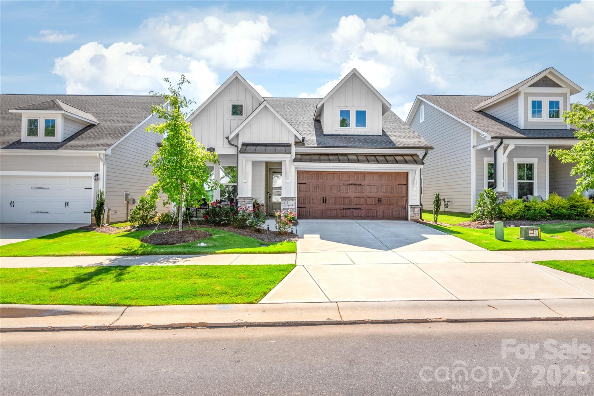 This is an outstanding, move-in ready home in Waxhaw's Encore at Streamside neighborhood. Better than new & loaded with upgrades! Popular 3-bedroom version of the Vibrant plan by David Weekley. The home is immaculate, and the owners have made several improvements. Solid floors throughout (no carpet!). Custom shelving added to master closet. Covered back porch has been turned into a three-season room, with glass doors, screens, & window treatments. Gorgeous paver patio out back, plus upgraded landscaping. Kitchen features white cabinets, stainless appliances, tiled back splash - as well as an attractive island and supplemental, built-in cabinet area. Desirable lot with ample distance to the homes behind it. Encore at Streamside was voted as the #1 new community in Charlotte. The neighborhood offers 55+ living with resort-style amenities including outdoor pool, gym, pickleball courts, clubhouse, dog park, walking trails & social events. Not to be missed!