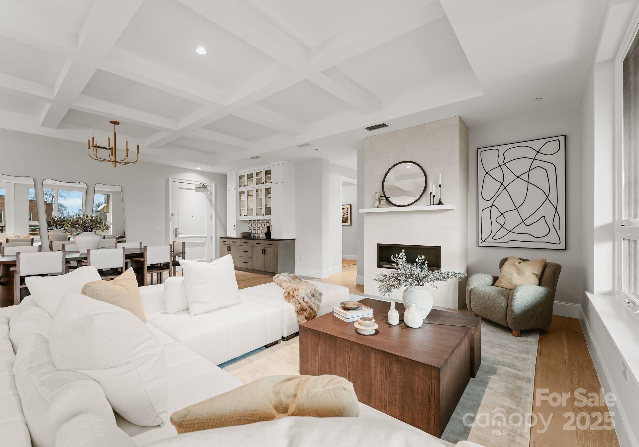 404 is the last remaining fourth-floor home offering coveted south-facing views and an expansive terrace outfitted with a vented Wolf grill. Designed for those who value light, privacy, and architectural refinement, the residence is framed by sightlines reminiscent of classic European settings. This three-bedroom, three-and-a-half-bath home features high ceilings, oversized windows, and a thoughtfully executed floor plan with a semi-private elevator. The kitchen is a study in timeless design, appointed with custom cabinetry, Sub-Zero refrigeration, Wolf appliances, and a Cove dishwasher. The spacious owner’s suite includes a spa-style bath with a free-standing tub, walk-in shower, and generous closet space. Amenities at The Regent include a concierge,  rooftop terrace with a fire pit, outdoor kitchen, lounge and dining areas, a club room, fitness center, and dog-friendly space.  Only 3 homes remain in this private enclave, Charlotte’s pinnacle of luxury call now for summer specials.