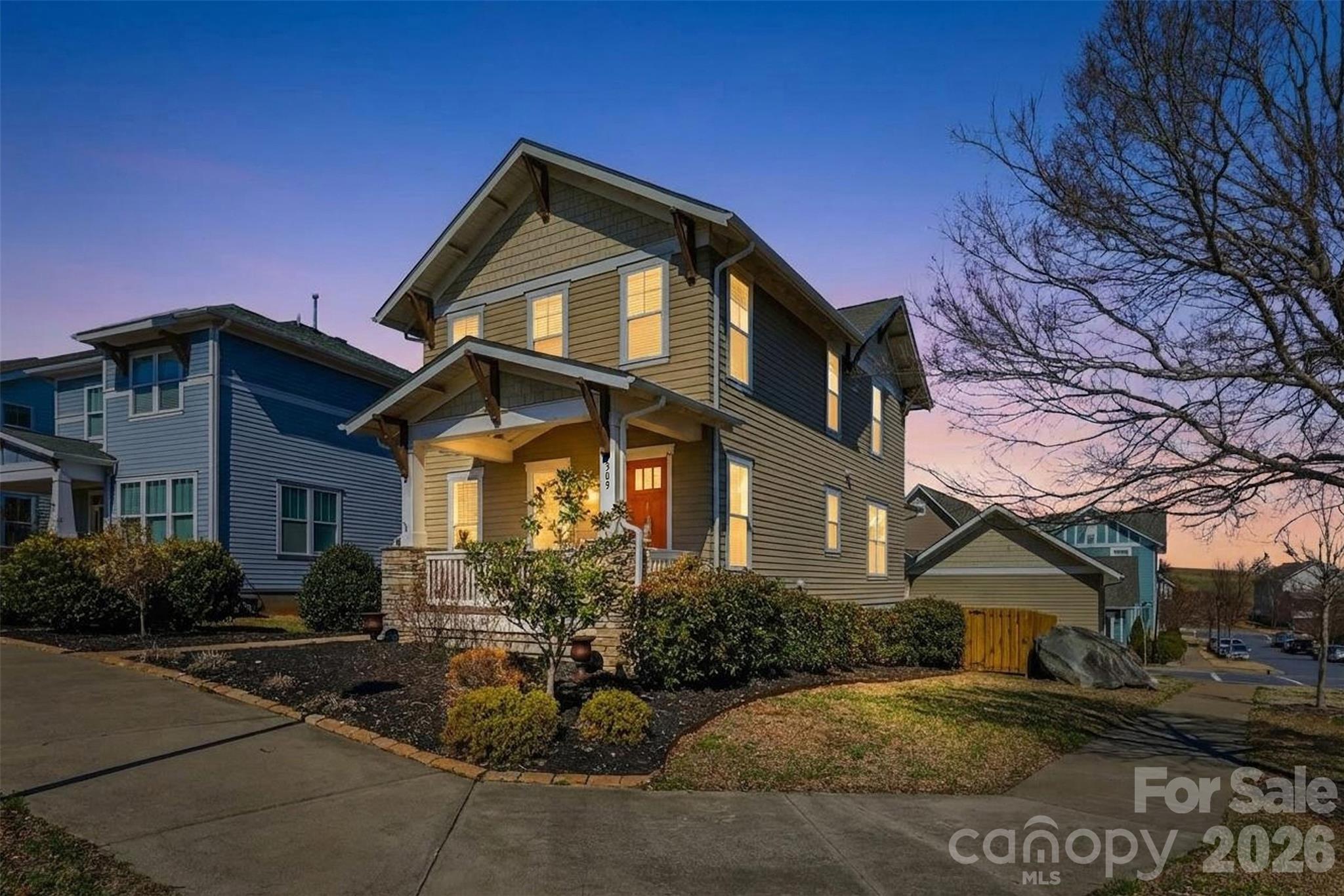 Located in the desirable Riverwalk community, this well-maintained home offers added privacy on a corner lot with only one adjacent neighbor, plus additional backyard space and parking.

Exterior features include covered front and rear porches, a fully fenced backyard, and a detached two-car garage with two additional private parking spaces. Storage area available beneath the rear deck.

Built by Evans Coghill Homes, the interior features an open-concept layout with abundant natural light, site-finished hardwood floors, detailed moldings, and dovetailed cabinetry. Kitchen includes stainless steel appliances, beveled subway tile backsplash, and an oversized island with seating for six. Fresh interior paint recently completed.

Community amenities include pool, pocket park, walking trails, and river access. Conveniently located near Rock Hill BMX Supercross Track, Giordana Velodrome, dining, shopping, and major highways.