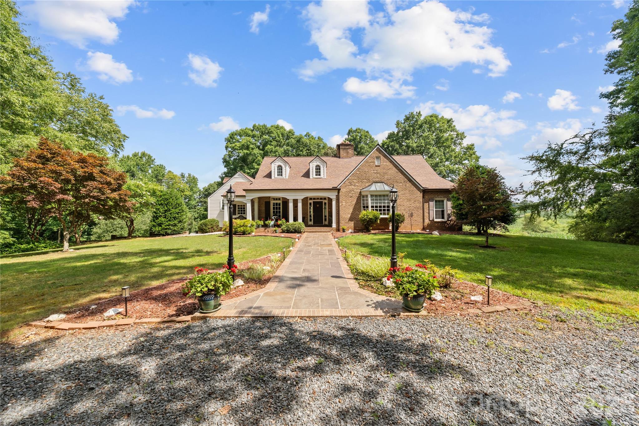 Gracious Living at its best!  Large home with more than ample space for living and entertaining.  2 Bedrooms on the main level with en suite baths, plus a hall half bath, forrmal dining room, wood paneled office with bay window, large living room with fireplace (gas Logs included) and deck access, great kitchen with plenty of prep space,  sunroom with deck access, family room, back foyer for family and friends entry with walk in Pantry, Launrdy room and lower lever garage space.  From the family room, there is an upstairs bedroom and bath.  From the foyer, there are stairs leading up to a craft room (with walk-in attic access) and to the basement, where there is a full bath, a game room with terrace access, and tons of unfinished space for future development.  Also, on the lower level, there is a workshop and the utility area for all the HVAC components.  Plus MUCH MUCH More.