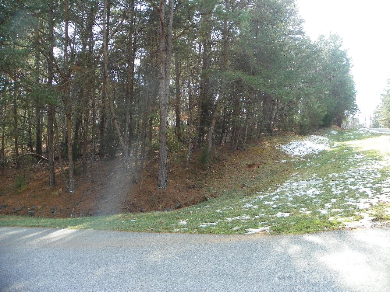 Property located in Beautiful, pristine, gated community of Heron Bay,  located on lovely Badin Lake. Badin Lake noted for: beauty, fishing, skiing, swimming and just relaxing! 
Build your home on this beautiful corner lot, lays great for a basement! Very short distance to the beautiful Club House with wrap around covered porch which has great view of Badin Lake and just right for relaxing! May reserve the Club House for personal events.  This beautiful, friendly  Community also has walking trails, fenced boat storage facility for a small fee. Boat launch/ Pier area. All paved lantern lit streets. Treat yourself and come take a look at beautiful Heron Bay.