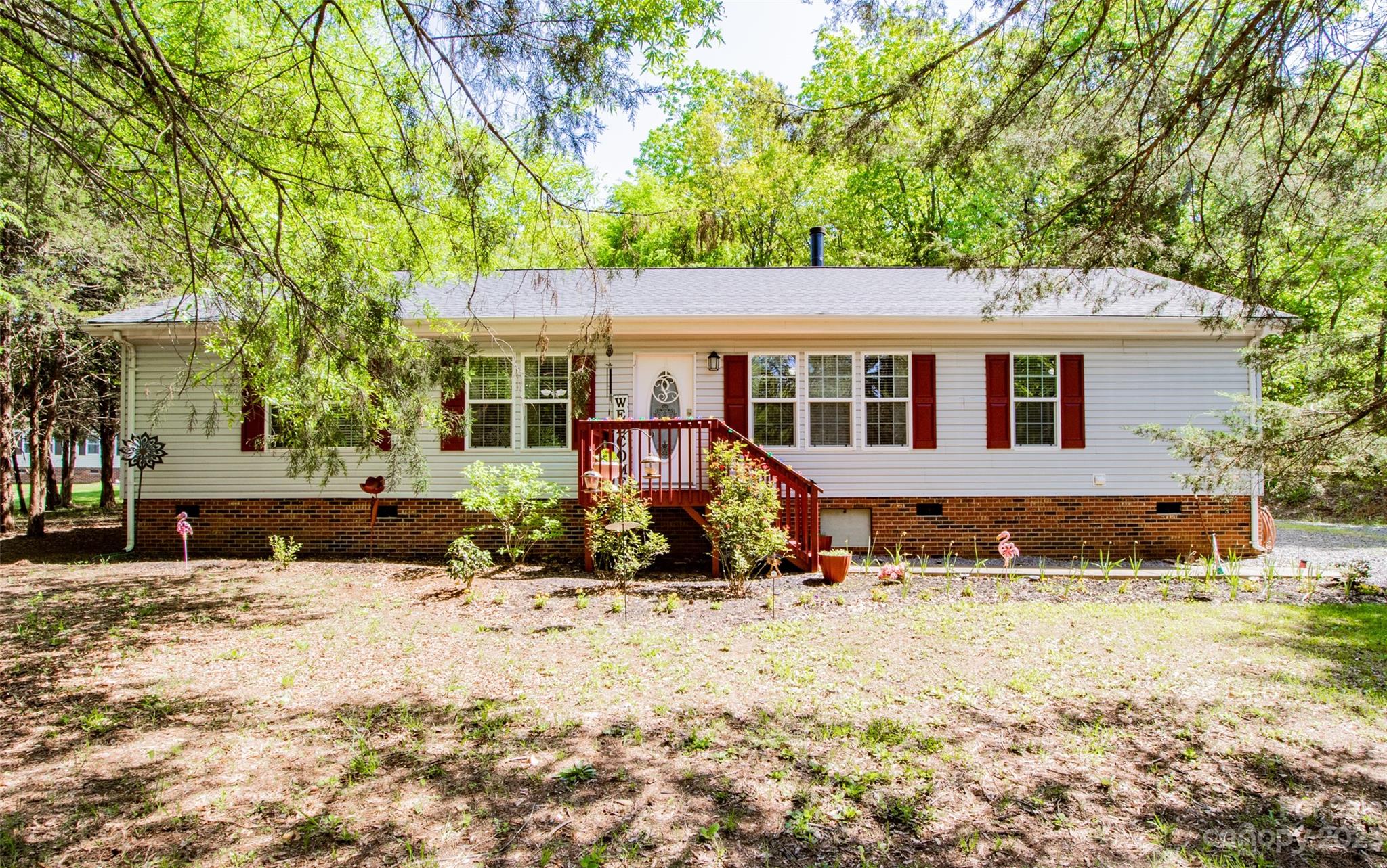 Move in ready Ranch! New Oct 2022 Roof, June 2022 HVAC (heat & air), Hardwoods/LVP throughout kitchen, dinning room, living room and primary bedroom, other 2 bedrooms have carpet. This home boasts with tons of natural light, spacious bedrooms, open floor plan and a backyard that's private and leveled perfect for entertainment or relaxation!