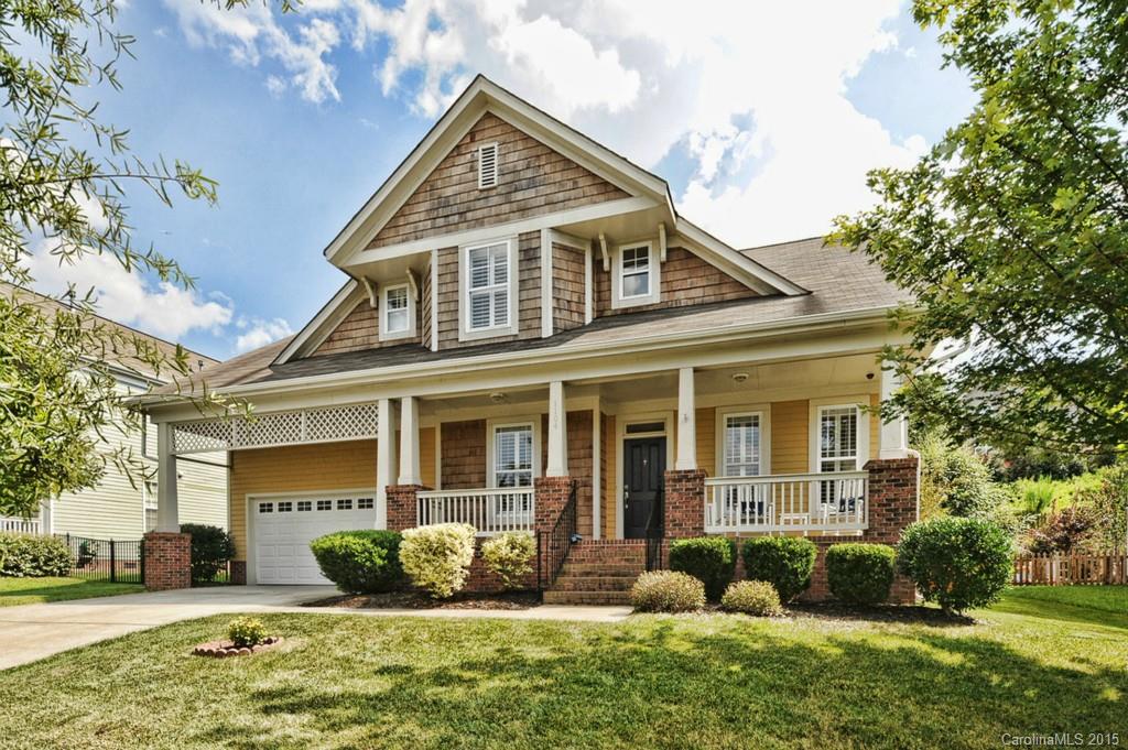 Welcome home to Lake Shore in the sought after Tega Cay Peninsula! This charming craftsman has all the right upgrades, hardwood flooring, plantation shutters, granite, open floor plan, master on main, large secondary bedrooms, nicely landscaped and spacious play yard and plenty of easy storage. Home is across the street from a park playground. Enjoy all the amenities of an active lake/golf community, parks, recreational lifestyle, Fort Mill Schools, new Tega Cay Elementary school. Hurry!